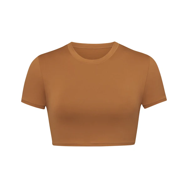 SWIM T-SHIRT LAYS FLAT ON A WHITE BACKGROUND | FLT