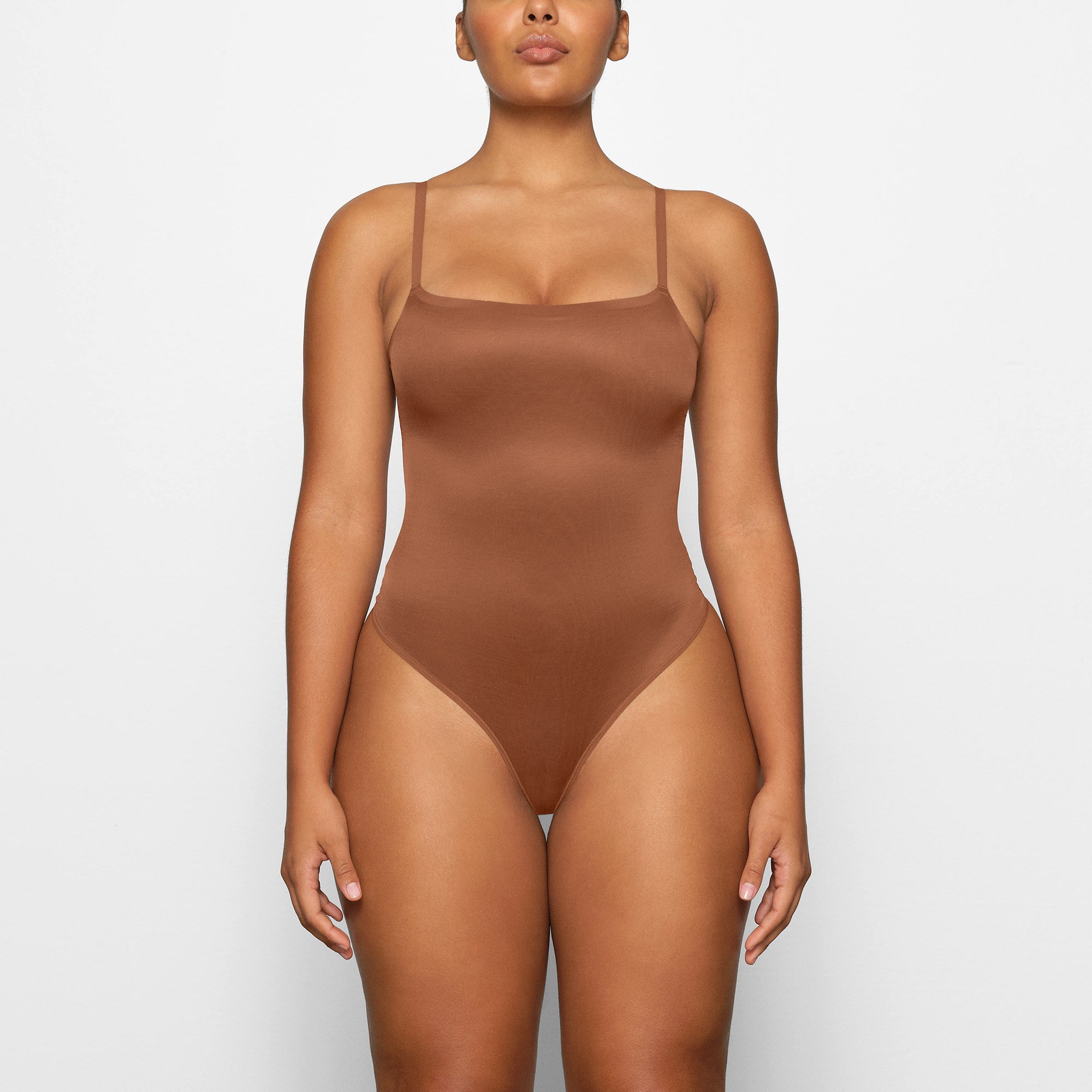 BARELY THERE SCOOP BODYSUIT WORN BY A MODEL IN FRONT VIEW | SEE: M, L, XL