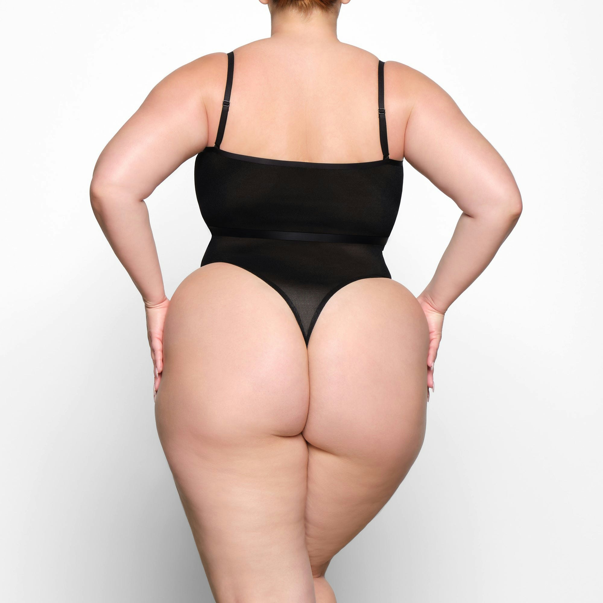 SHEER SCULPT BANDEAU WORN BY A MODEL IN BACK VIEW