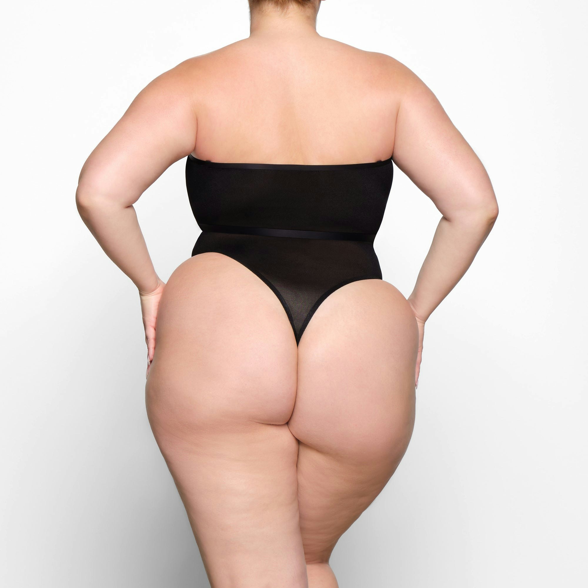 SHEER SCULPT BANDEAU WORN BY A MODEL IN BACK VIEW