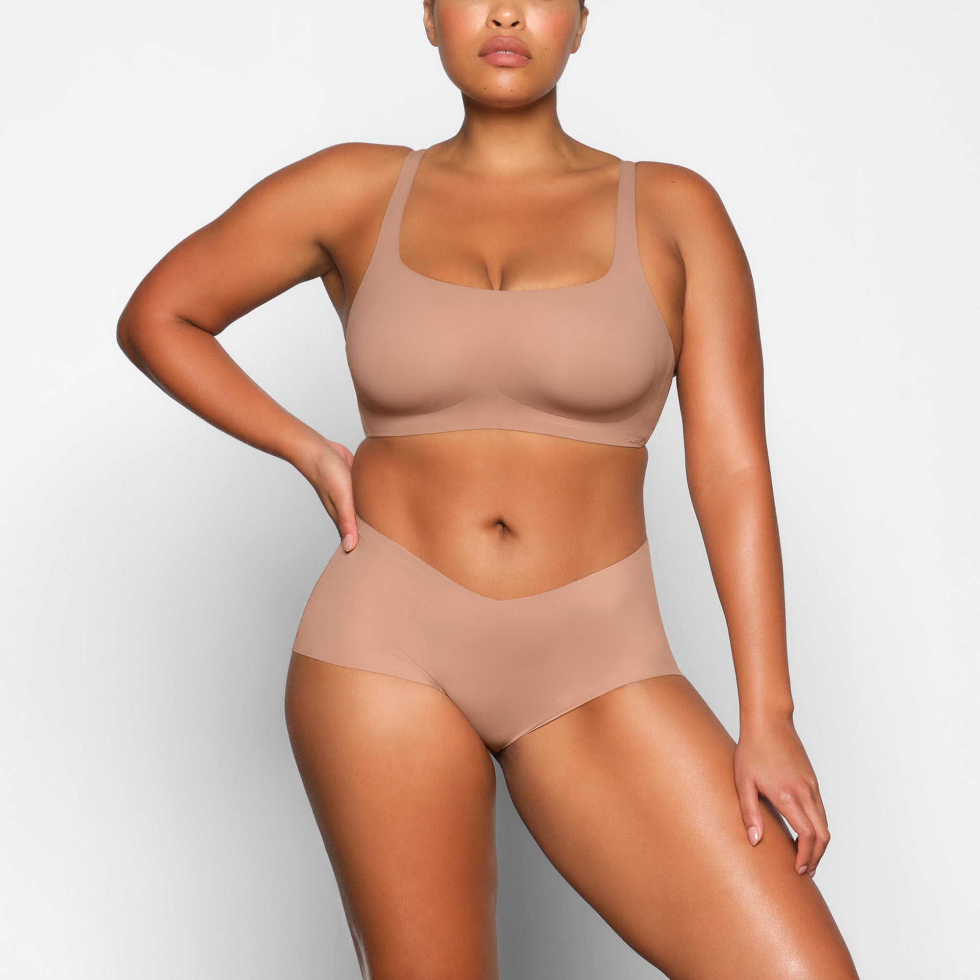 NAKED SCOOP BRA WORN BY A MODEL IN FRONT VIEW | SEE: M, L, XL