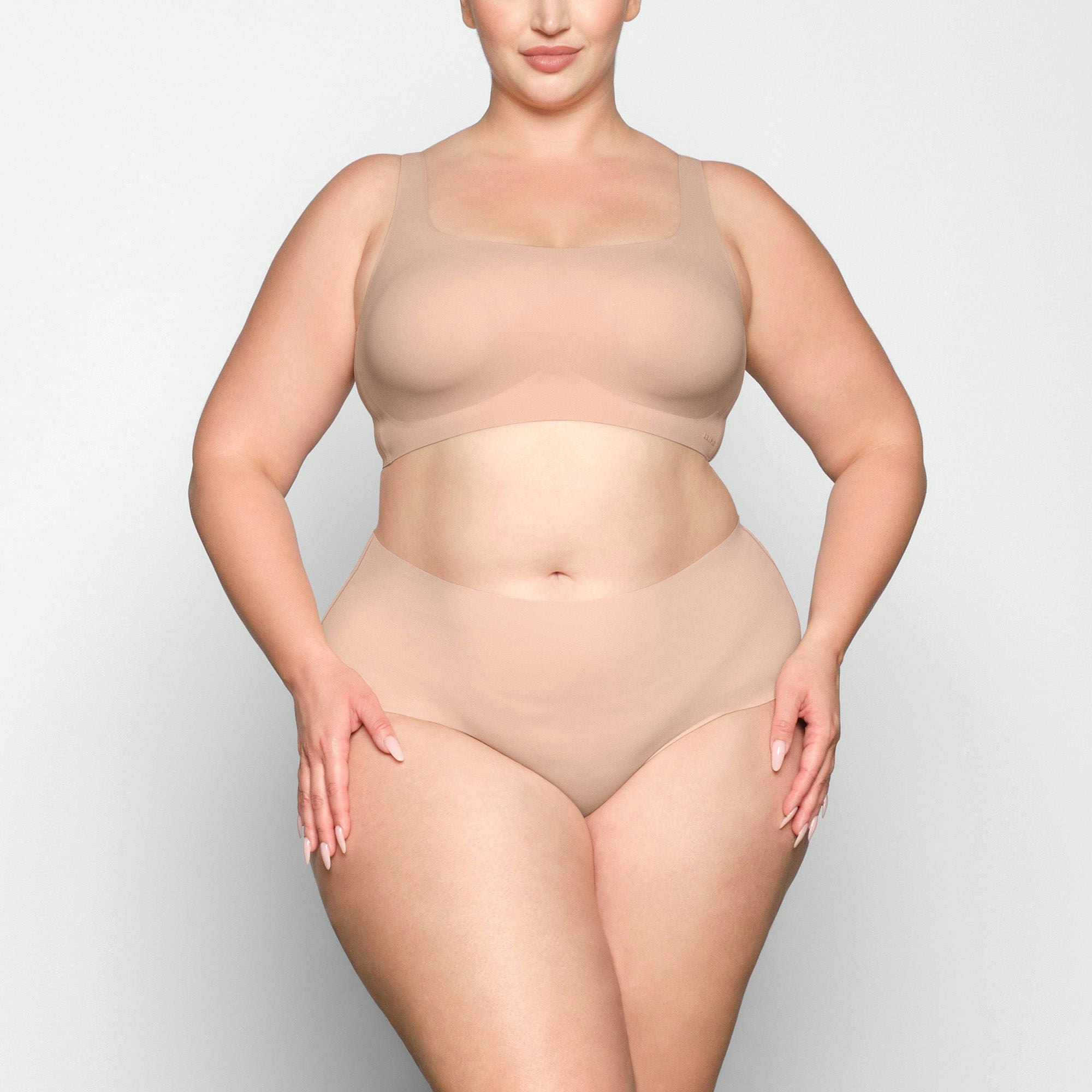 NAKED SCOOP BRA WORN BY A MODEL IN FRONT VIEW | SEE: 2X, 3X, 4X