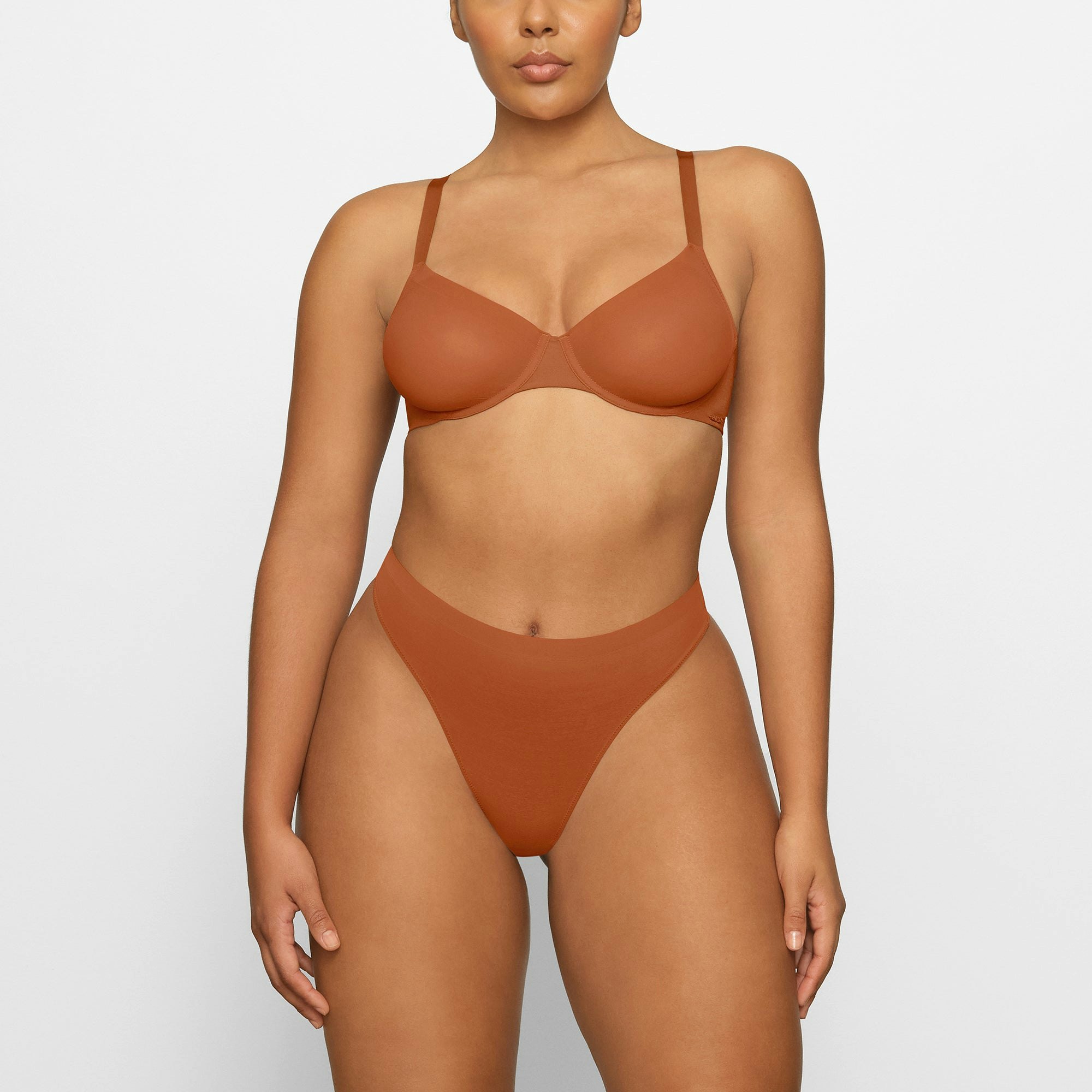 NO SHOW MOLDED UNLINED DEMI BRA WORN BY A MODEL IN FRONT VIEW