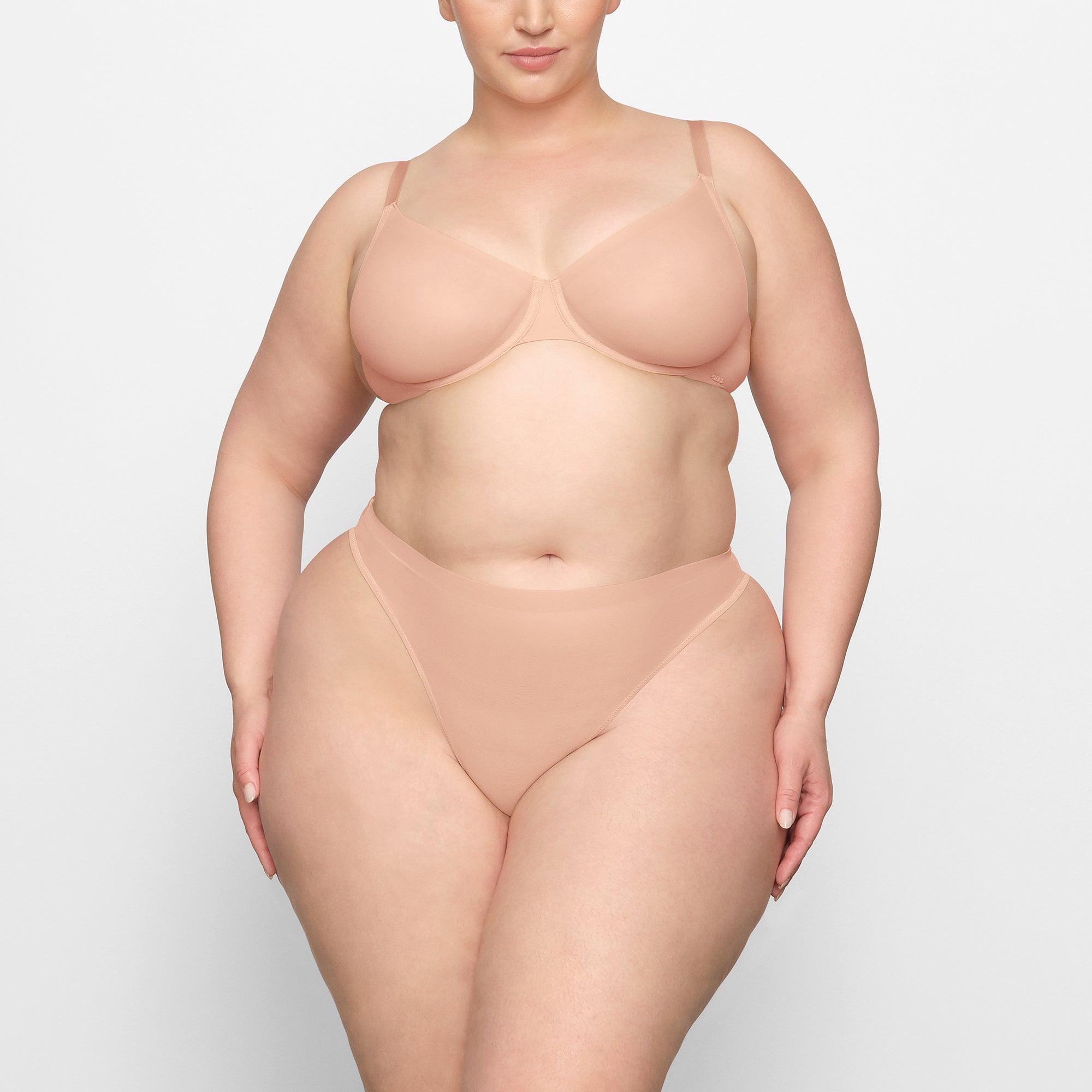 NO SHOW MOLDED UNLINED DEMI BRA WORN BY A MODEL IN FRONT VIEW