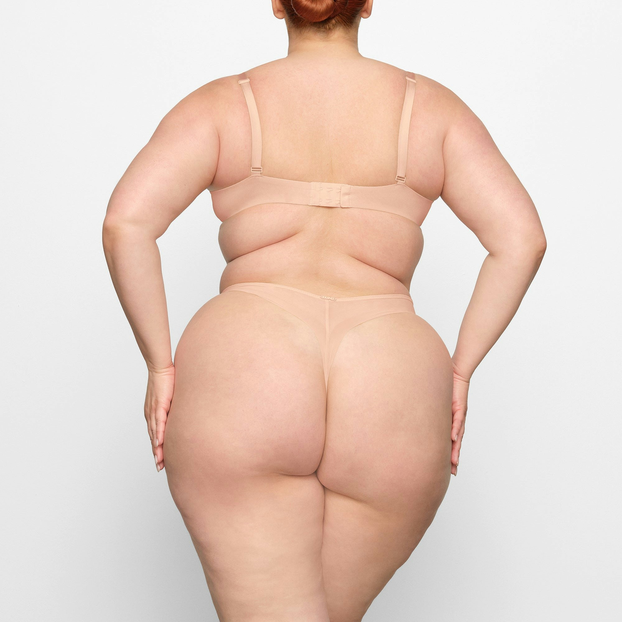 NO SHOW MOLDED UNLINED DEMI BRA ON A MODEL BACK VIEW