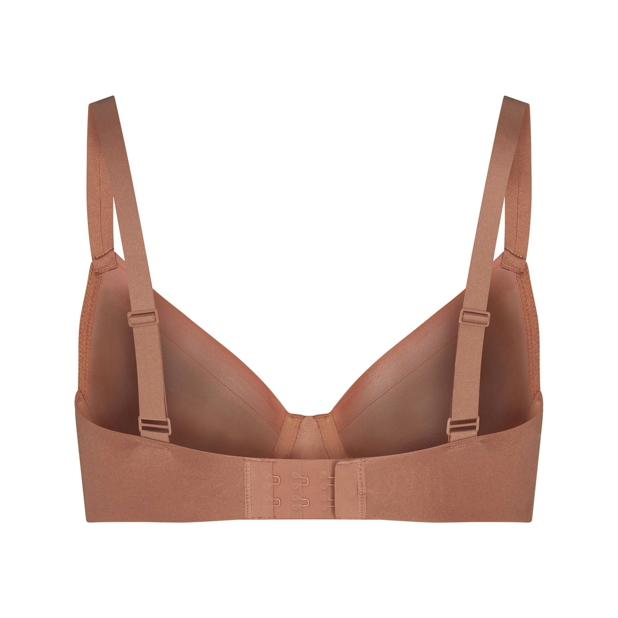 NO SHOW MOLDED UNLINED DEMI BRA LAYS FLAT ON A WHITE BACKGROUND | FLT