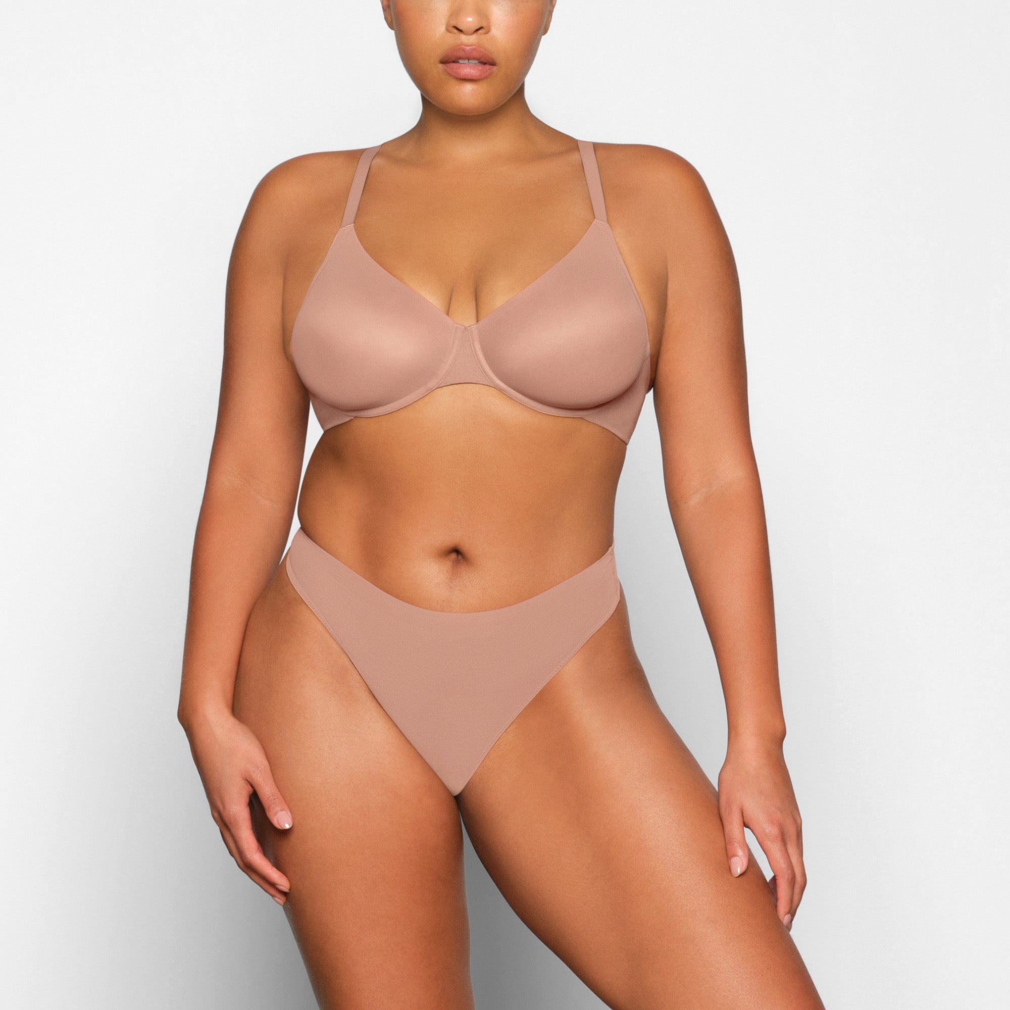 NO SHOW MOLDED UNLINED DEMI BRA WORN BY A MODEL IN FRONT VIEW