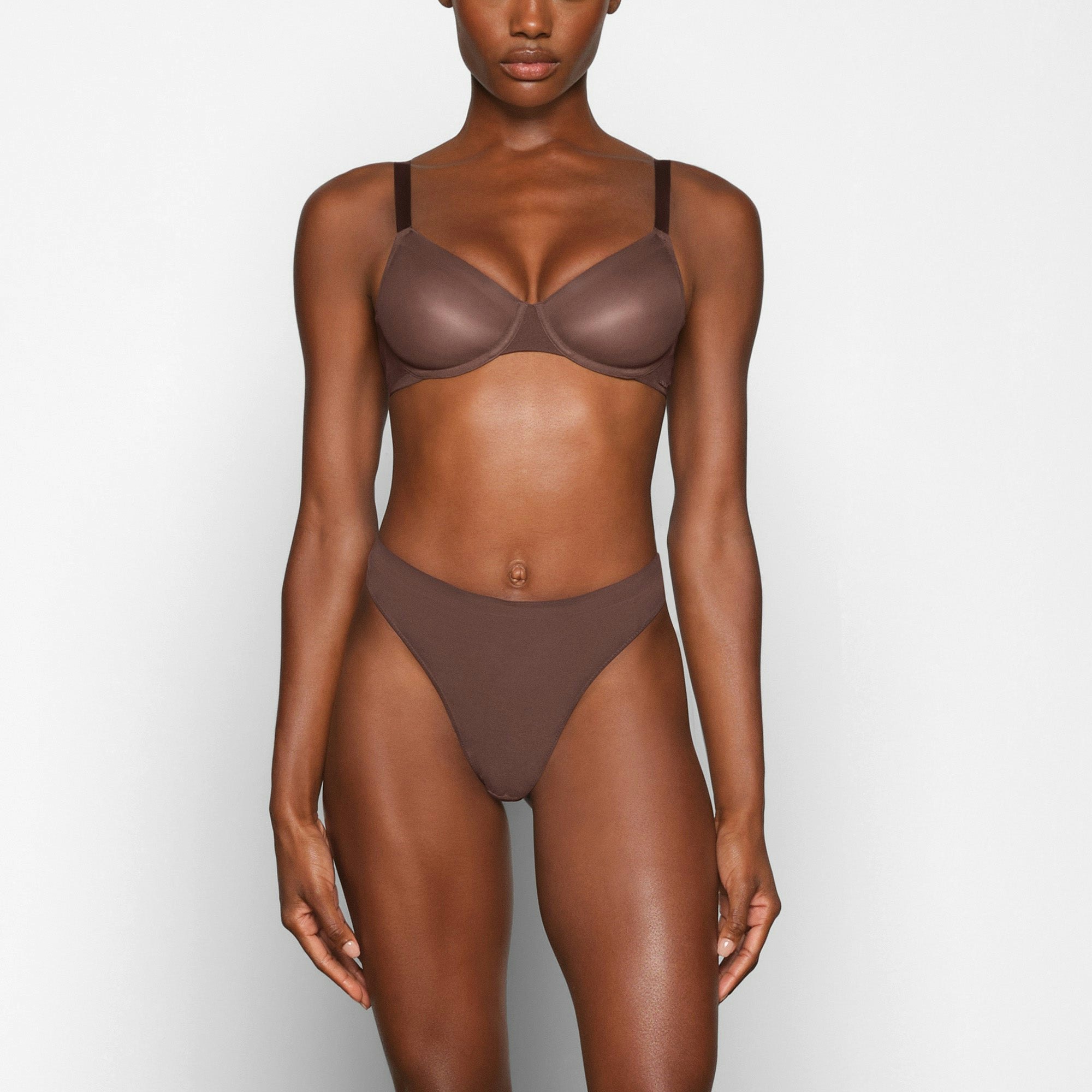 NO SHOW MOLDED UNLINED DEMI BRA WORN BY A MODEL IN FRONT VIEW