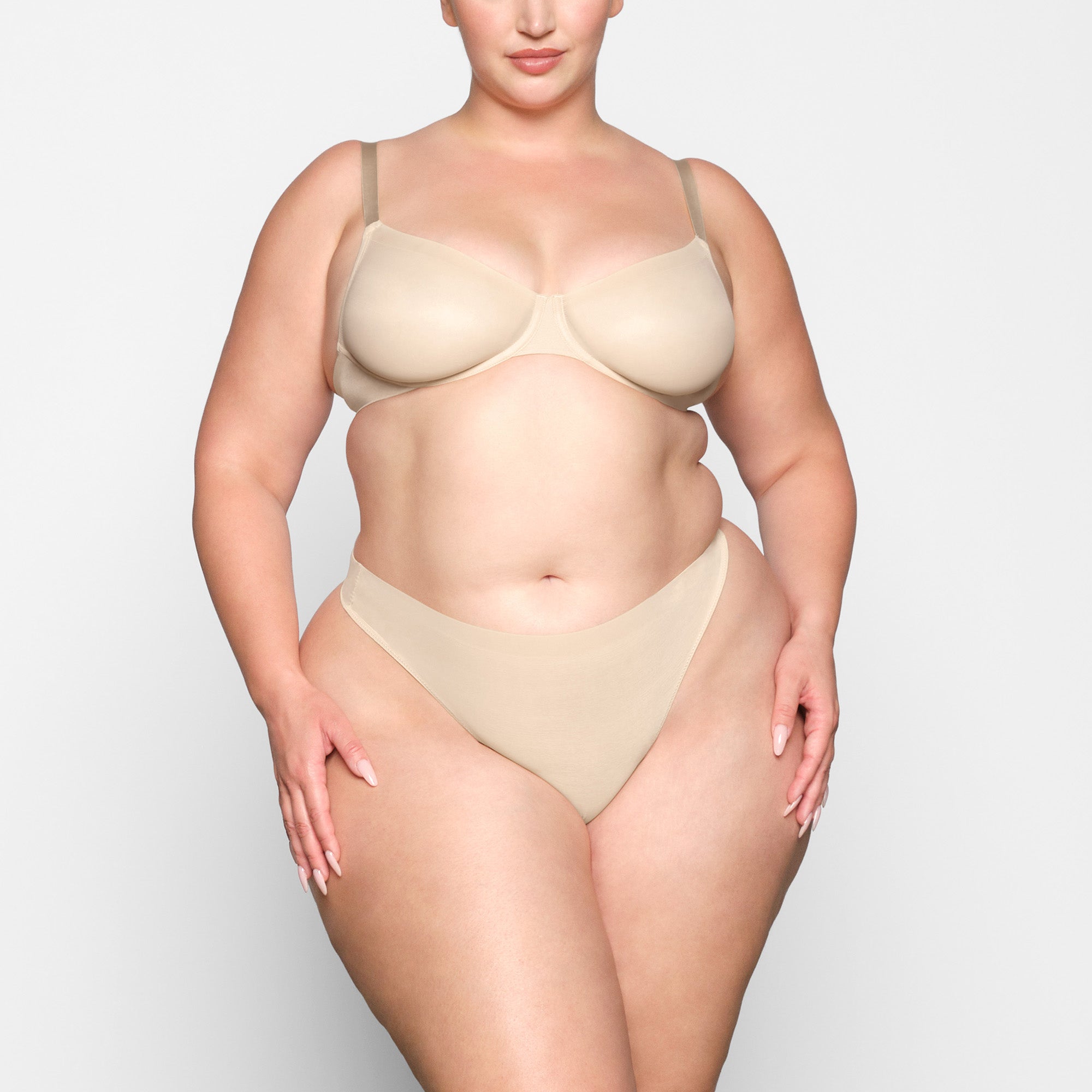 NO SHOW MOLDED UNLINED DEMI BRA WORN BY A MODEL IN FRONT VIEW