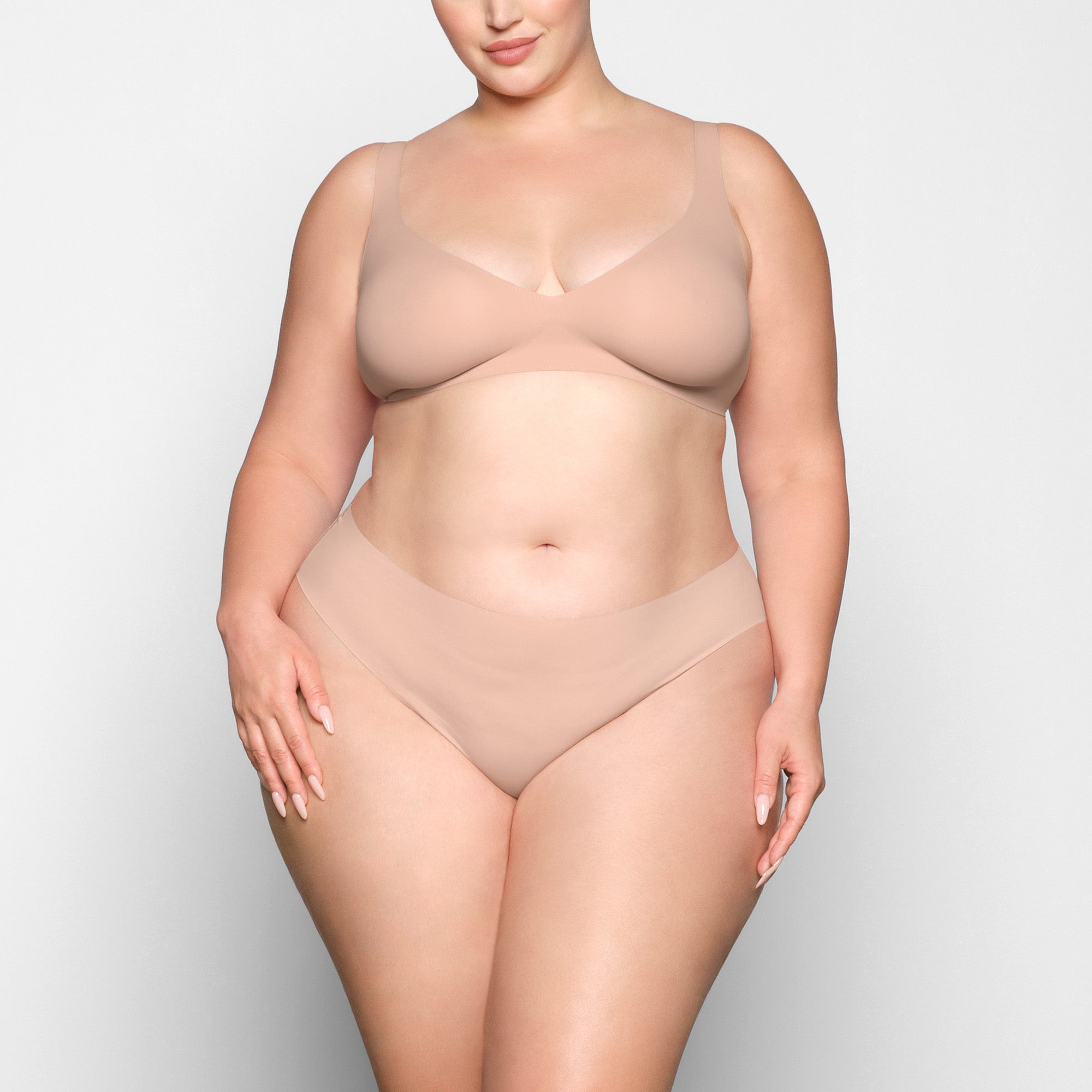 NAKED PLUNGE BRA WORN BY A MODEL IN FRONT VIEW | SEE: 2X, 3X, 4X