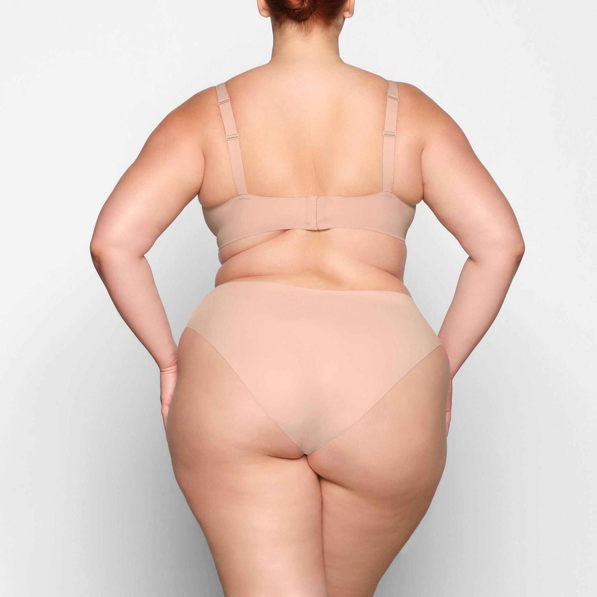 NAKED PLUNGE BRA ON A MODEL BACK VIEW