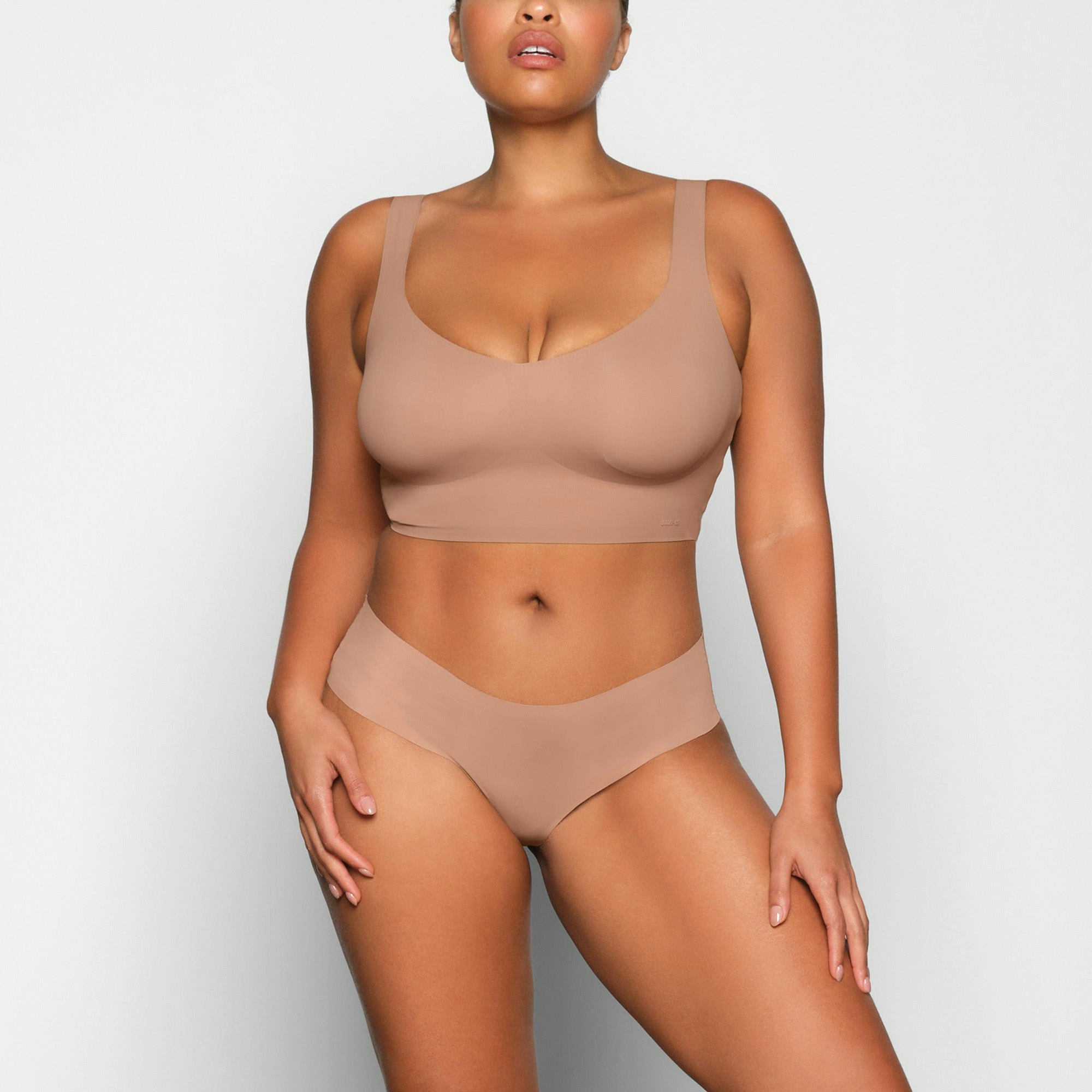 NAKED PLUNGE LONGLINE BRA WORN BY A MODEL IN FRONT VIEW | SEE: M, L, XL