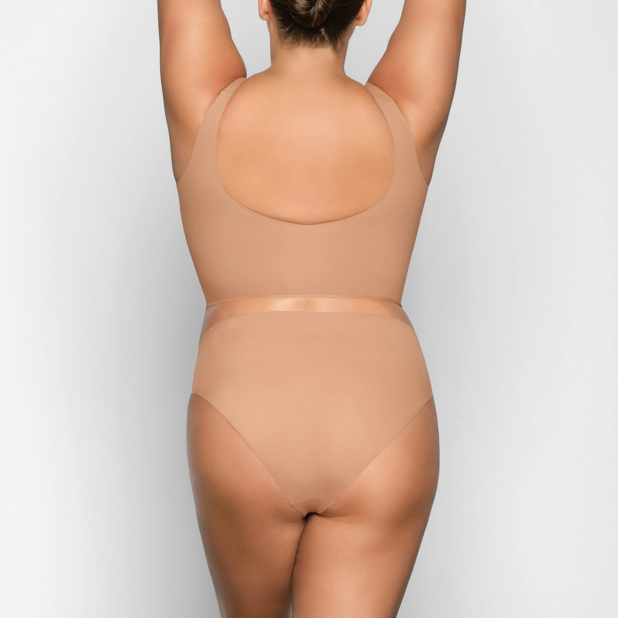 NAKED PLUNGE LONGLINE BRA ON A MODEL BACK VIEW