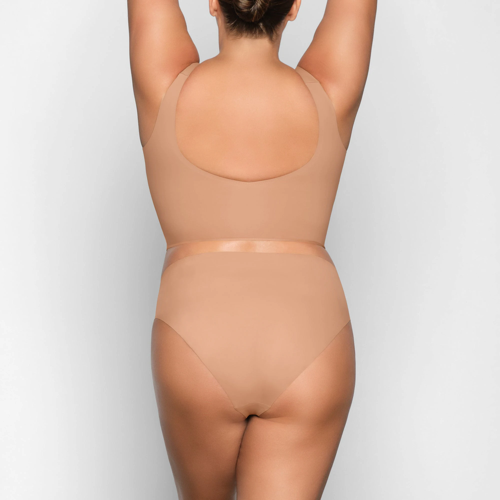 NAKED PLUNGE LONGLINE BRA ON A MODEL BACK VIEW
