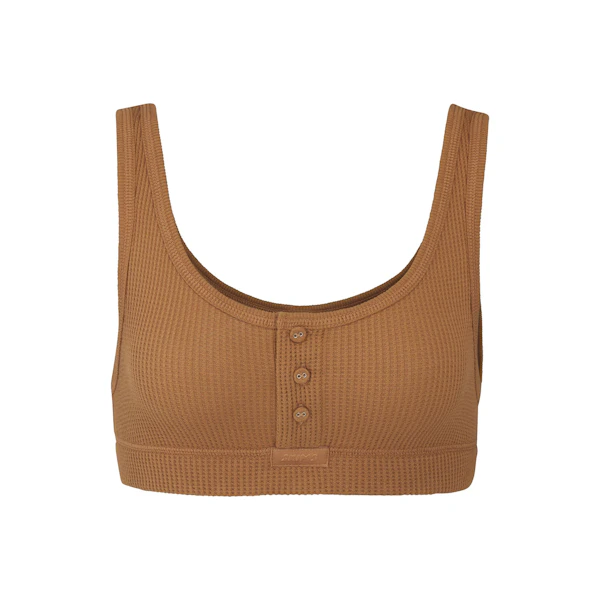 WAFFLE HENLEY BRA LAYS FLAT ON A WHITE BACKGROUND