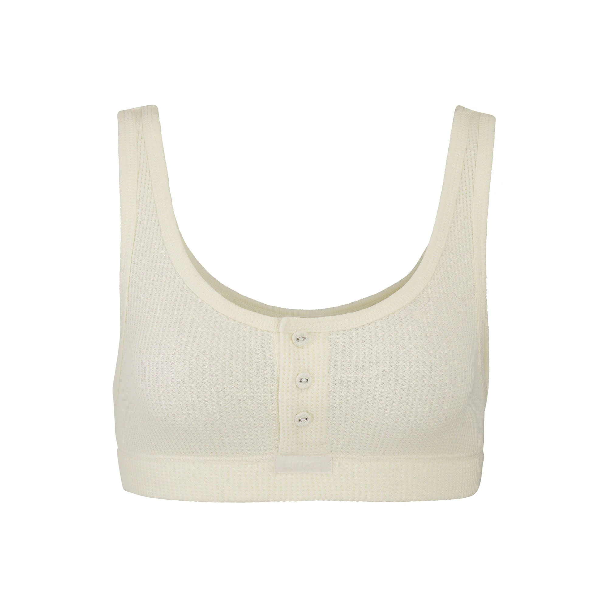 WAFFLE HENLEY BRA LAYS FLAT ON A WHITE BACKGROUND
