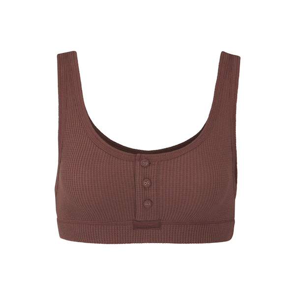 WAFFLE HENLEY BRA LAYS FLAT ON A WHITE BACKGROUND
