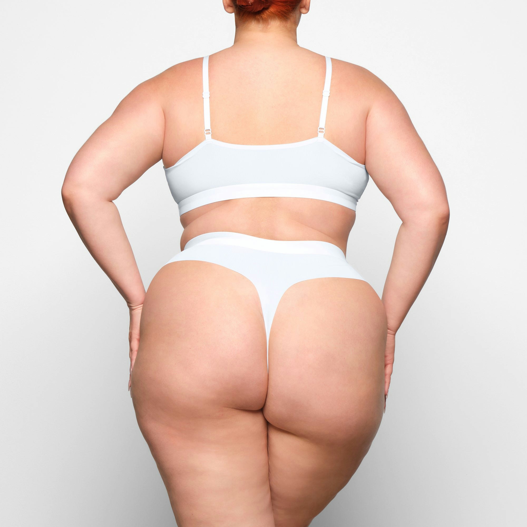 SMOOTH RIB SCOOP NECK BRALETTE WORN BY A MODEL IN BACK VIEW