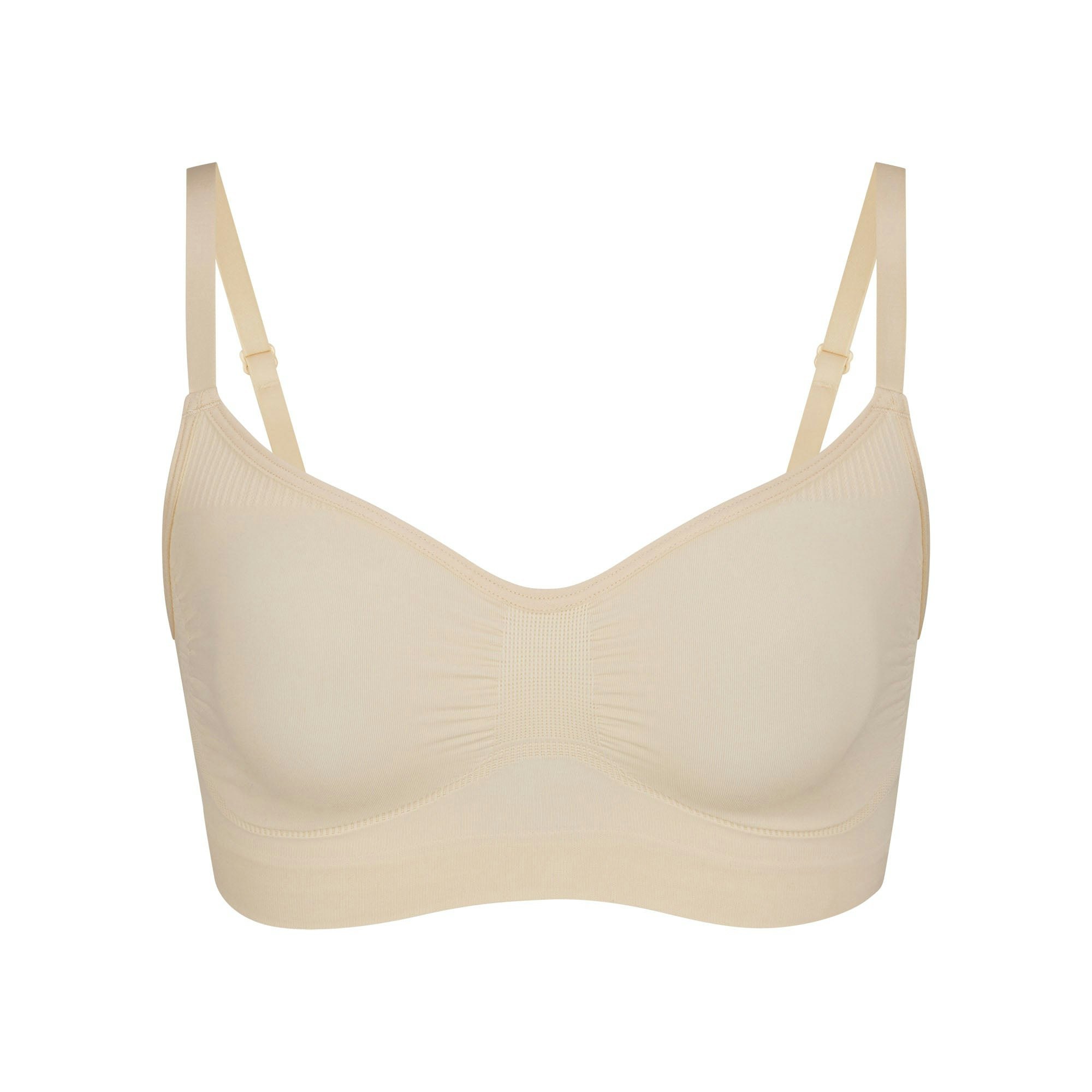 SEAMLESS SCULPT BRALETTE | SAND (SHAPEWEAR BRALETTES, BRAS) LAYS FLAT ON A WHITE BACKGROUND | FLT