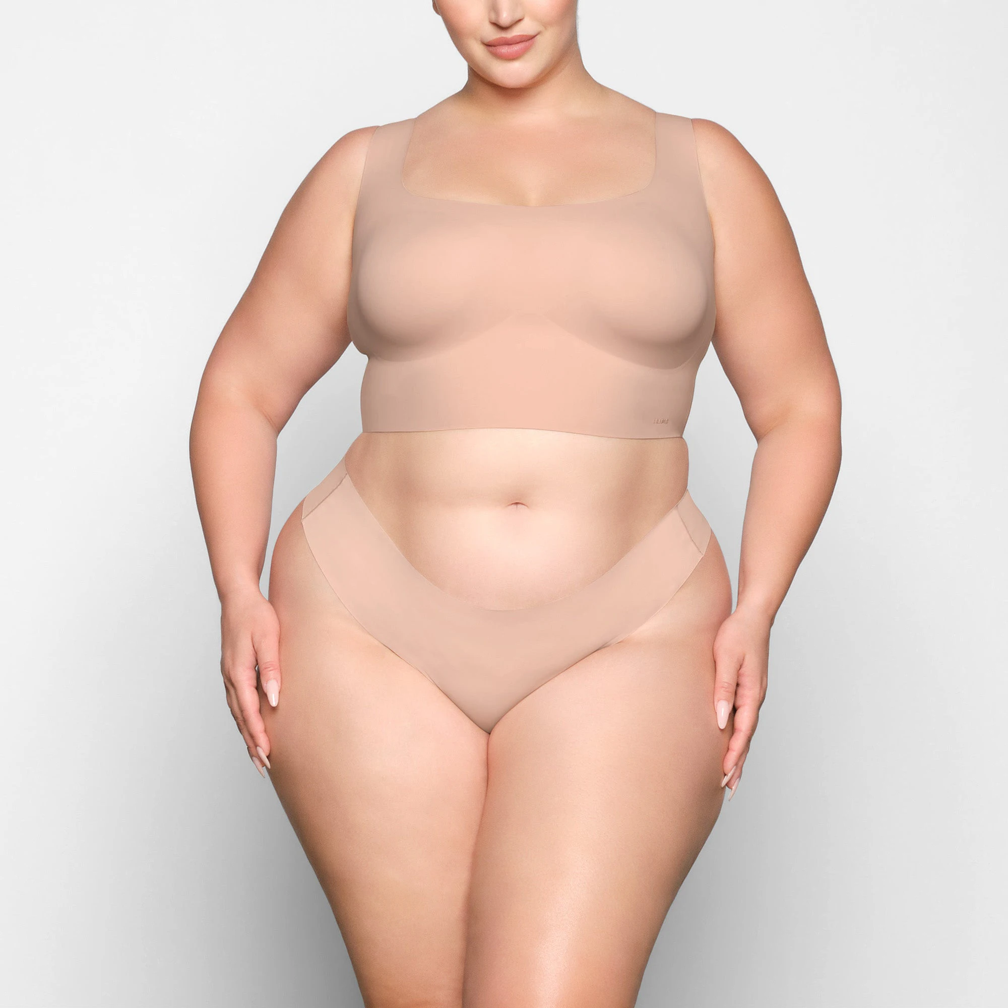 NAKED SCOOP LONGLINE BRA WORN BY A MODEL IN FRONT VIEW | SEE: 2X, 3X, 4X