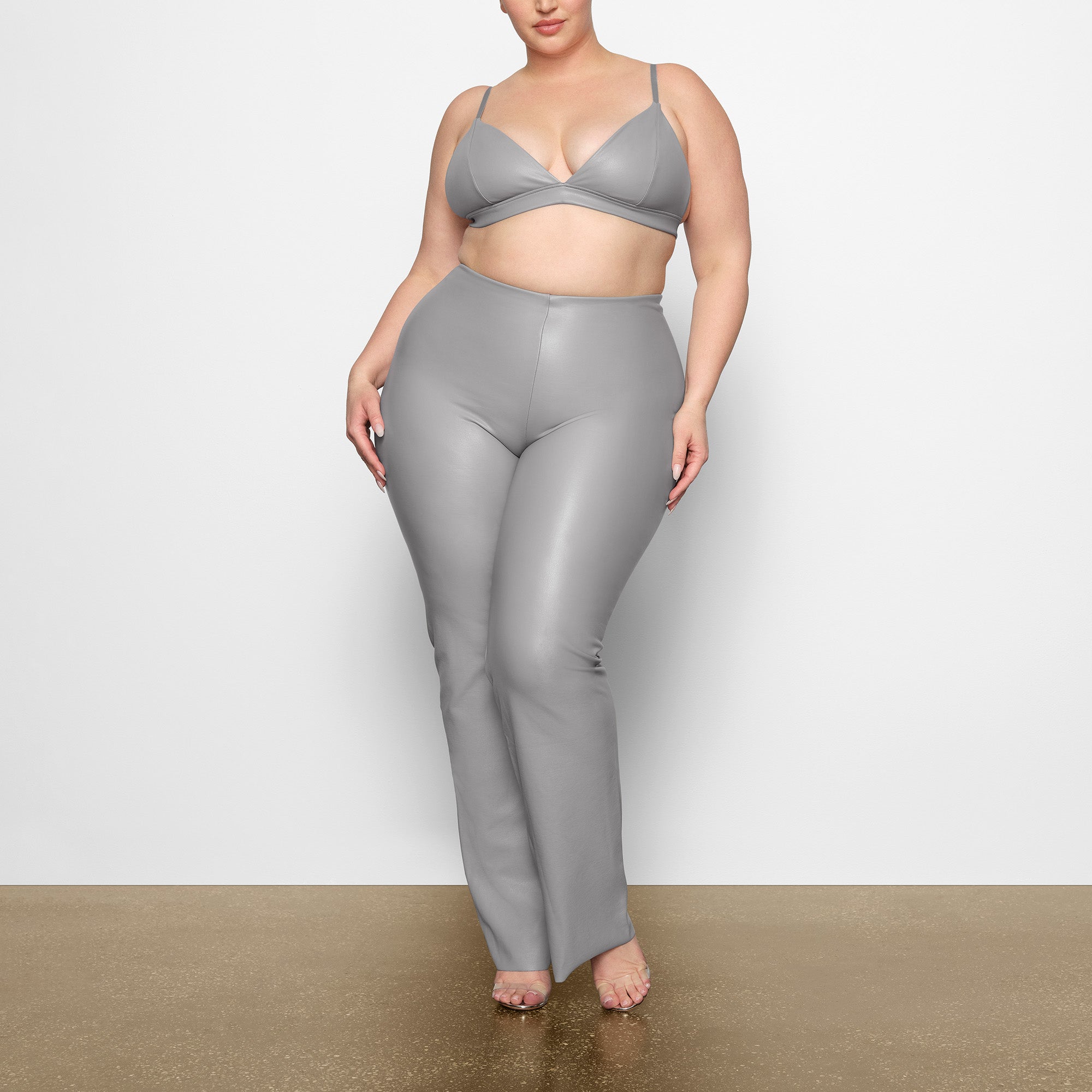 FAUX LEATHER TRIANGLE BRALETTE WORN BY A MODEL IN FRONT VIEW | SEE: 2X, 3X, 4X