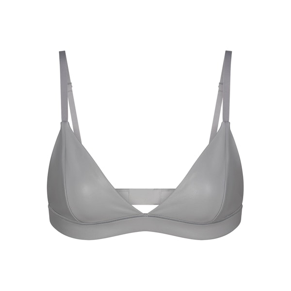 FAUX LEATHER TRIANGLE BRALETTE LAYS FLAT ON A WHITE BACKGROUND