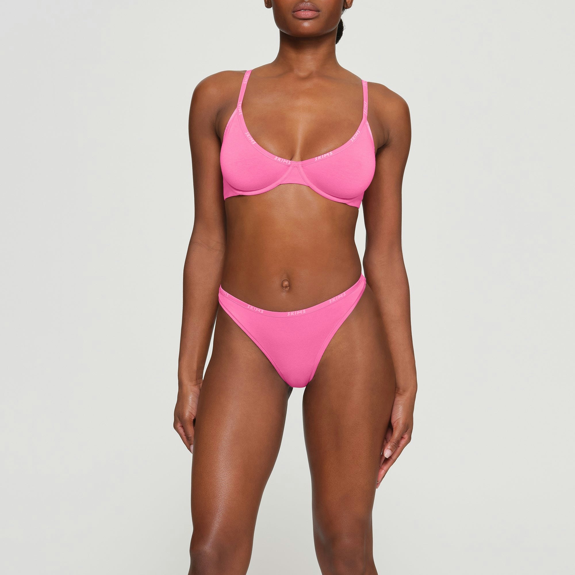 COTTON LOGO UNDERWIRE DEMI BRA WORN BY A MODEL IN FRONT VIEW