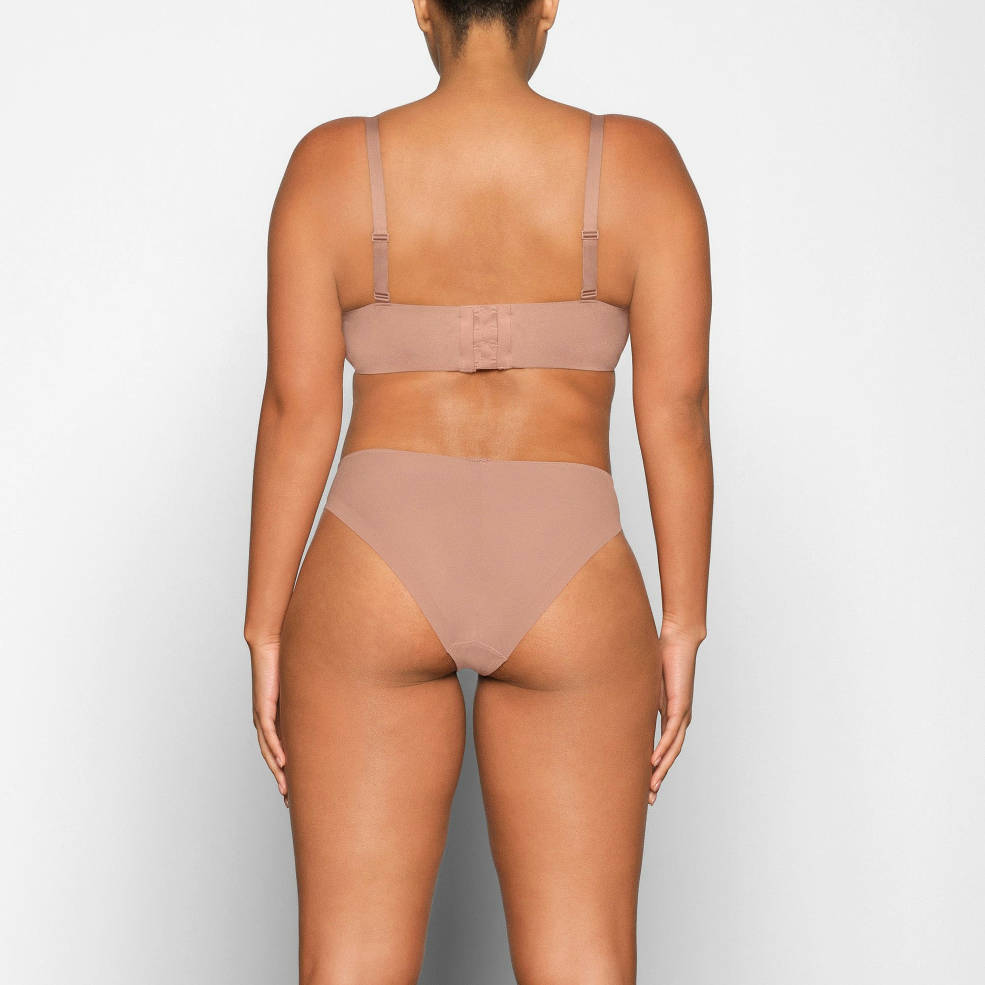 NO SHOW MOLDED UNLINED BALCONETTE BRA ON A MODEL BACK VIEW