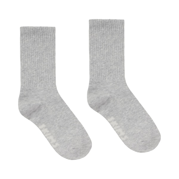 SPORT CREW SOCK | LIGHT HEATHER GREY (CREW SOCKS) LAYS FLAT ON A WHITE BACKGROUND | FLT