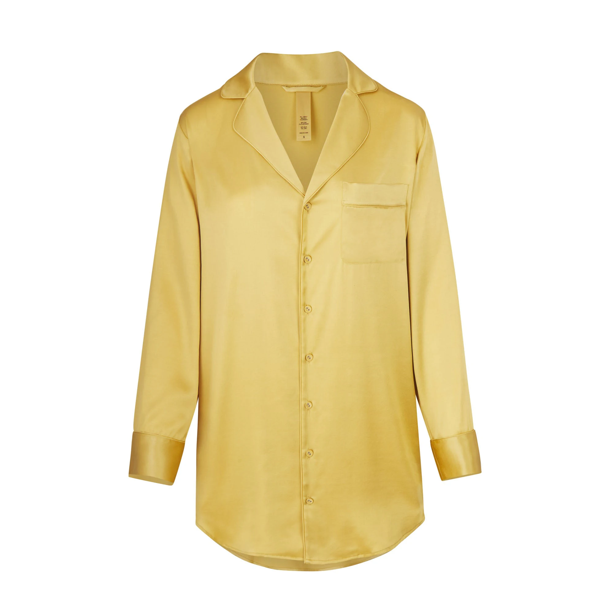 SILK BUTTON UP NIGHT DRESS LAYS FLAT ON A WHITE BACKGROUND