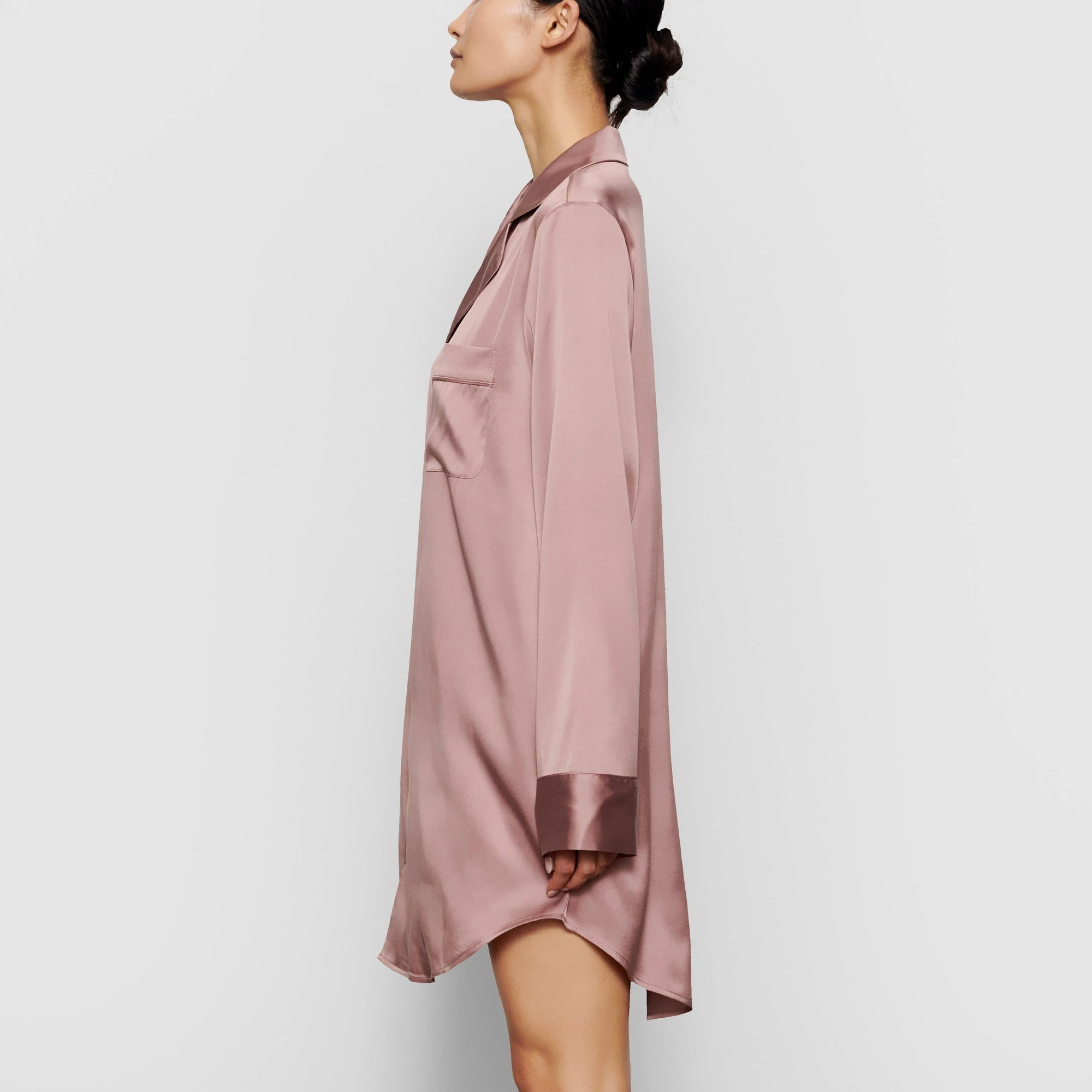A MODEL STANDS SIDEWAYS SHOWING THE PROFILE OF THE SILK BUTTON UP NIGHT DRESS | ROSE