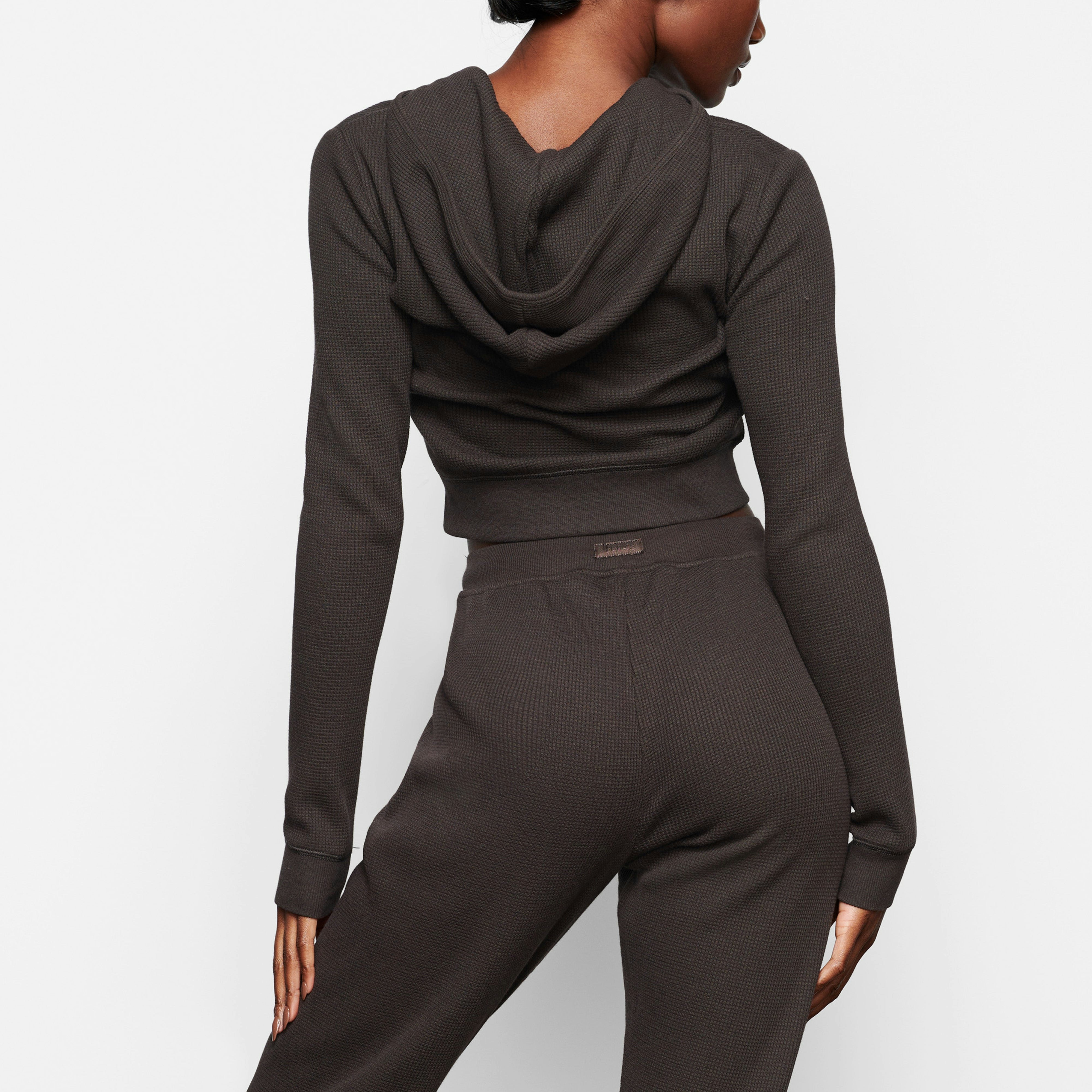 A MODEL WEARS THE WAFFLE HOODIE