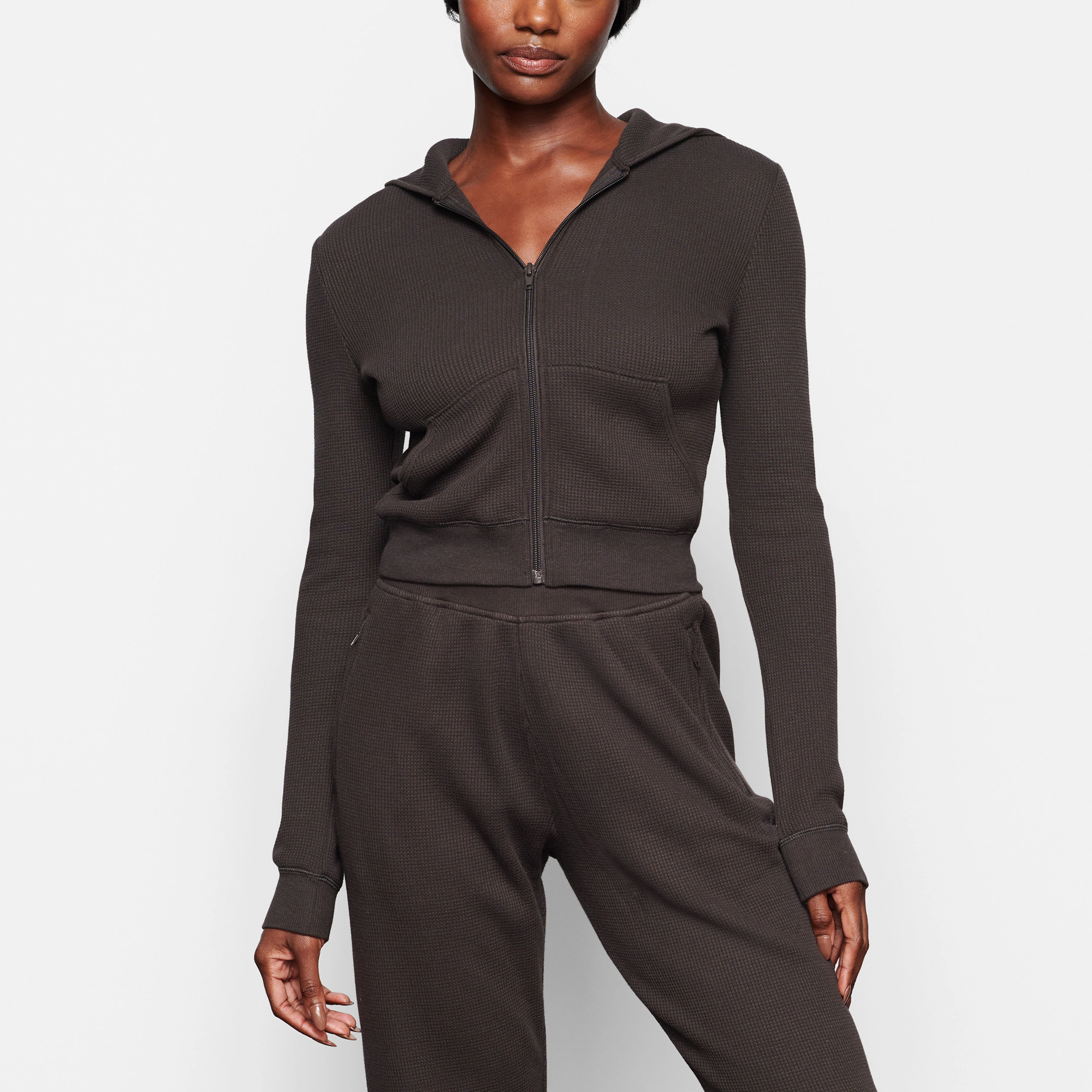 A MODEL WEARS THE WAFFLE HOODIE