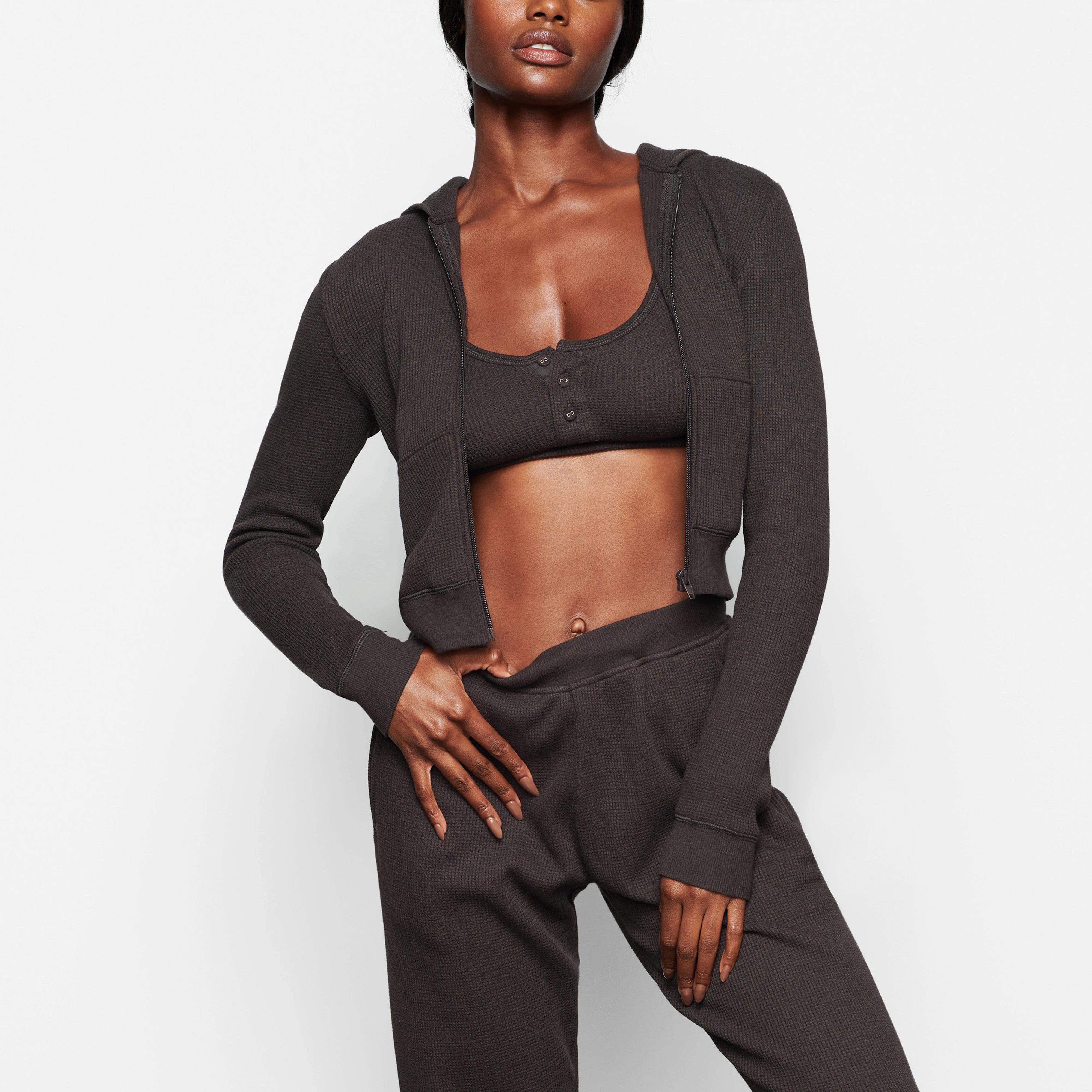 A MODEL WEARS THE WAFFLE HOODIE