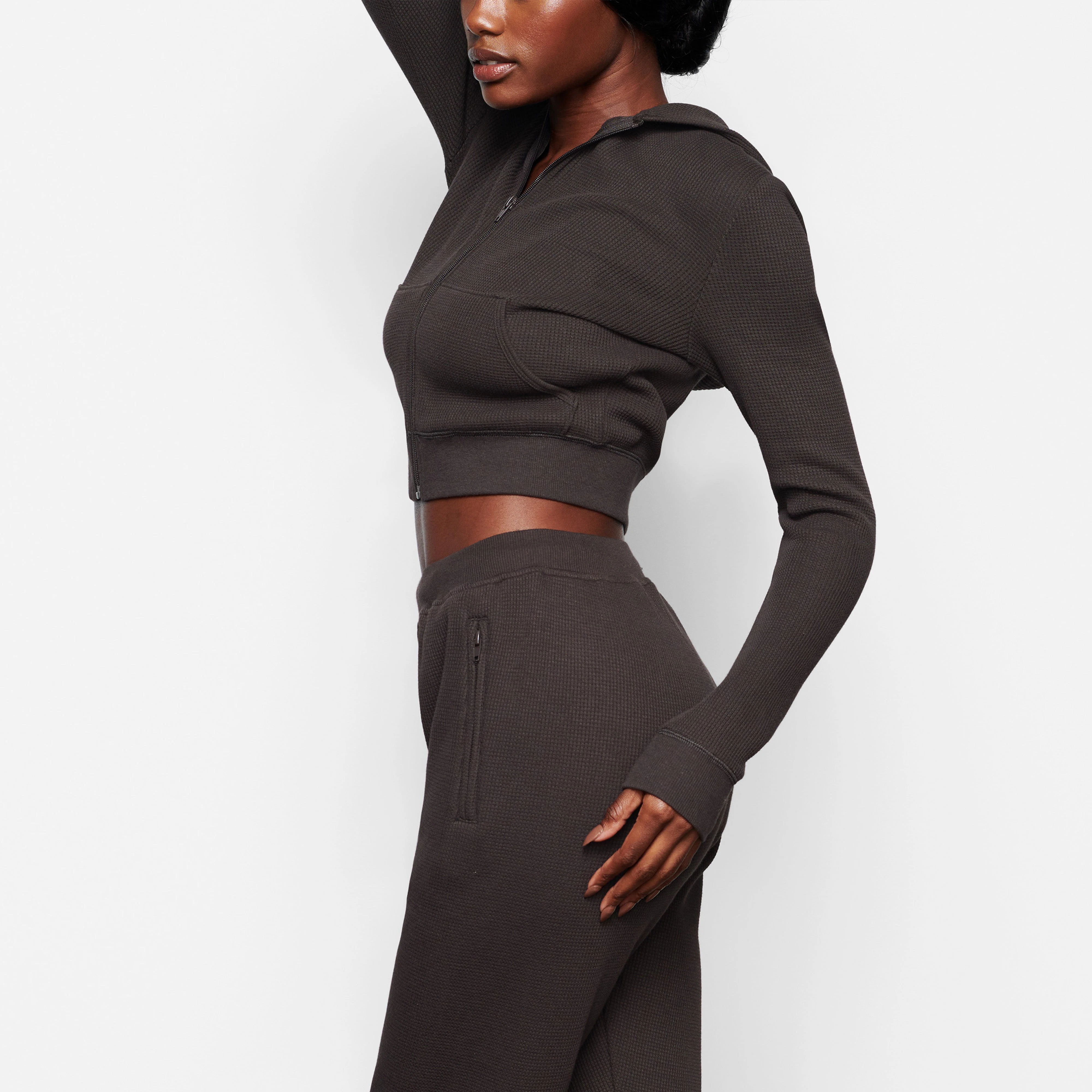 A MODEL WEARS THE WAFFLE HOODIE