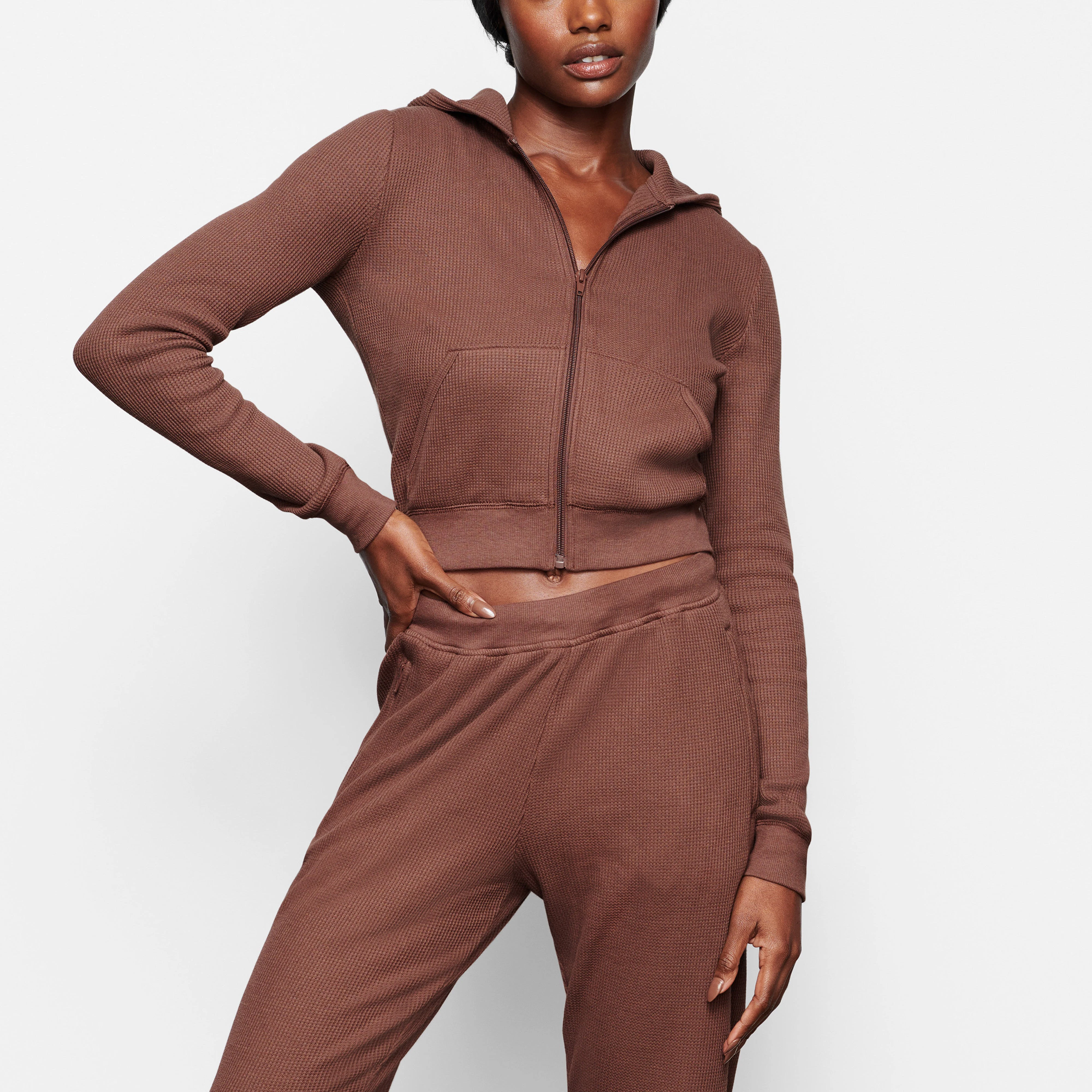 A MODEL WEARS THE WAFFLE HOODIE