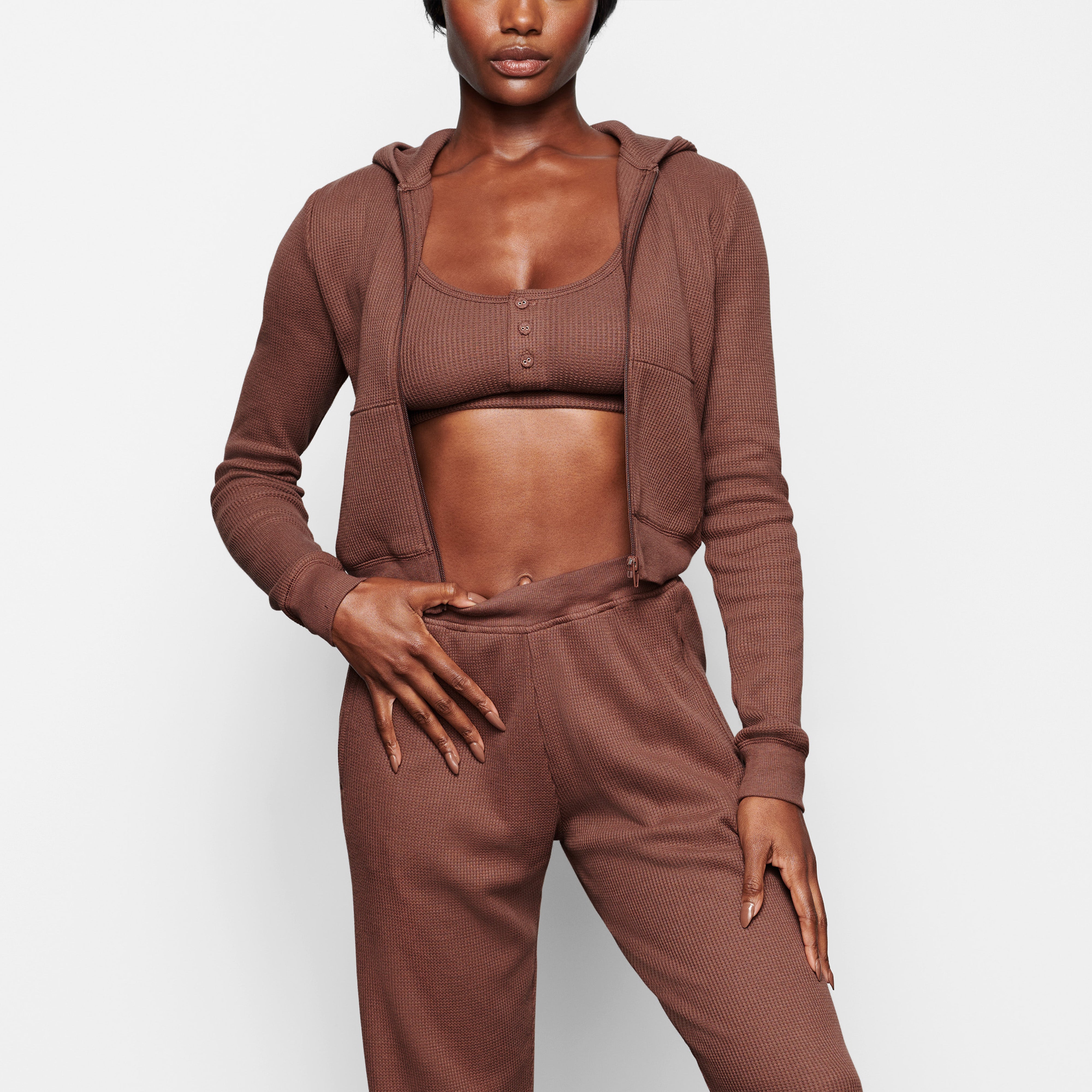 A MODEL WEARS THE WAFFLE HOODIE