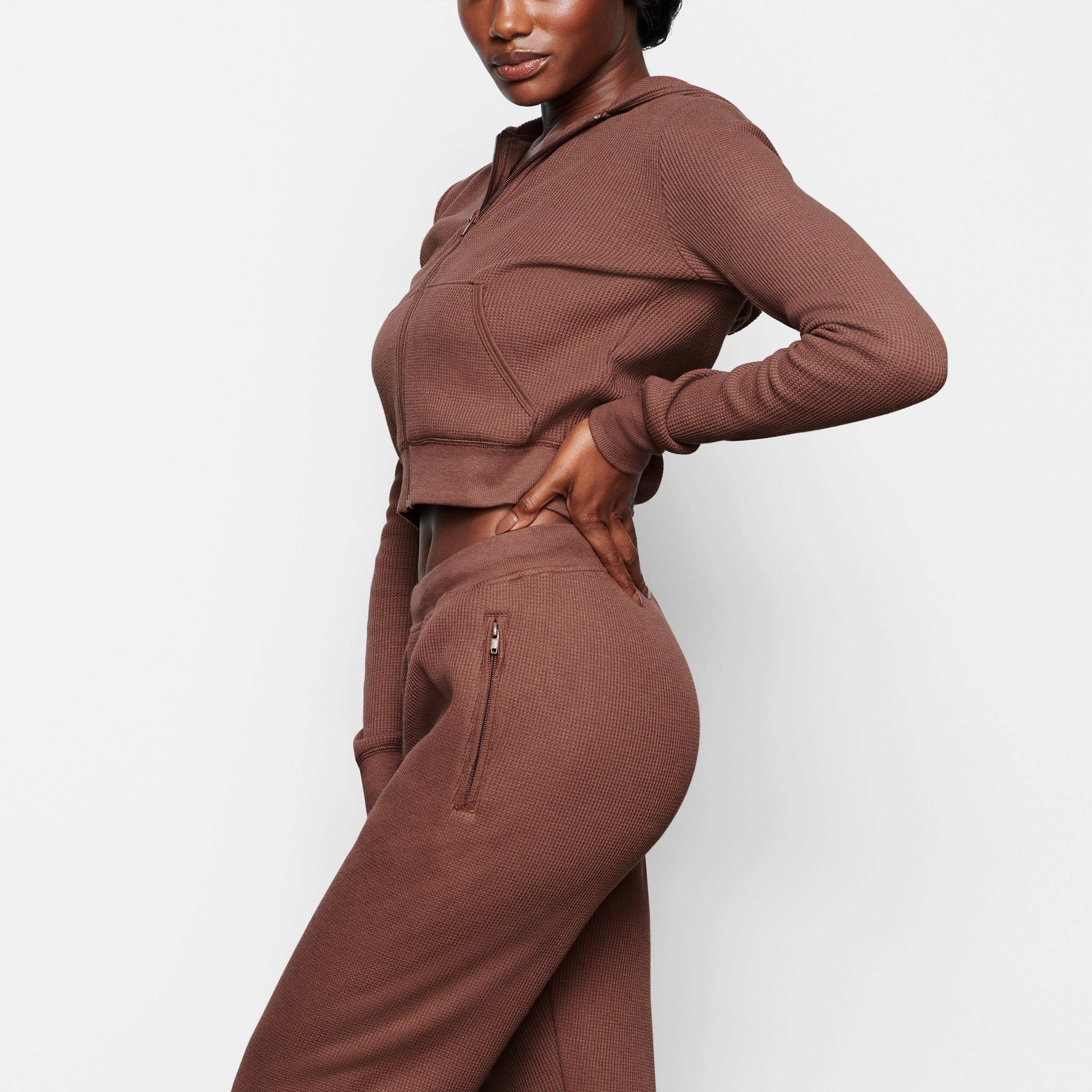 A MODEL WEARS THE WAFFLE HOODIE