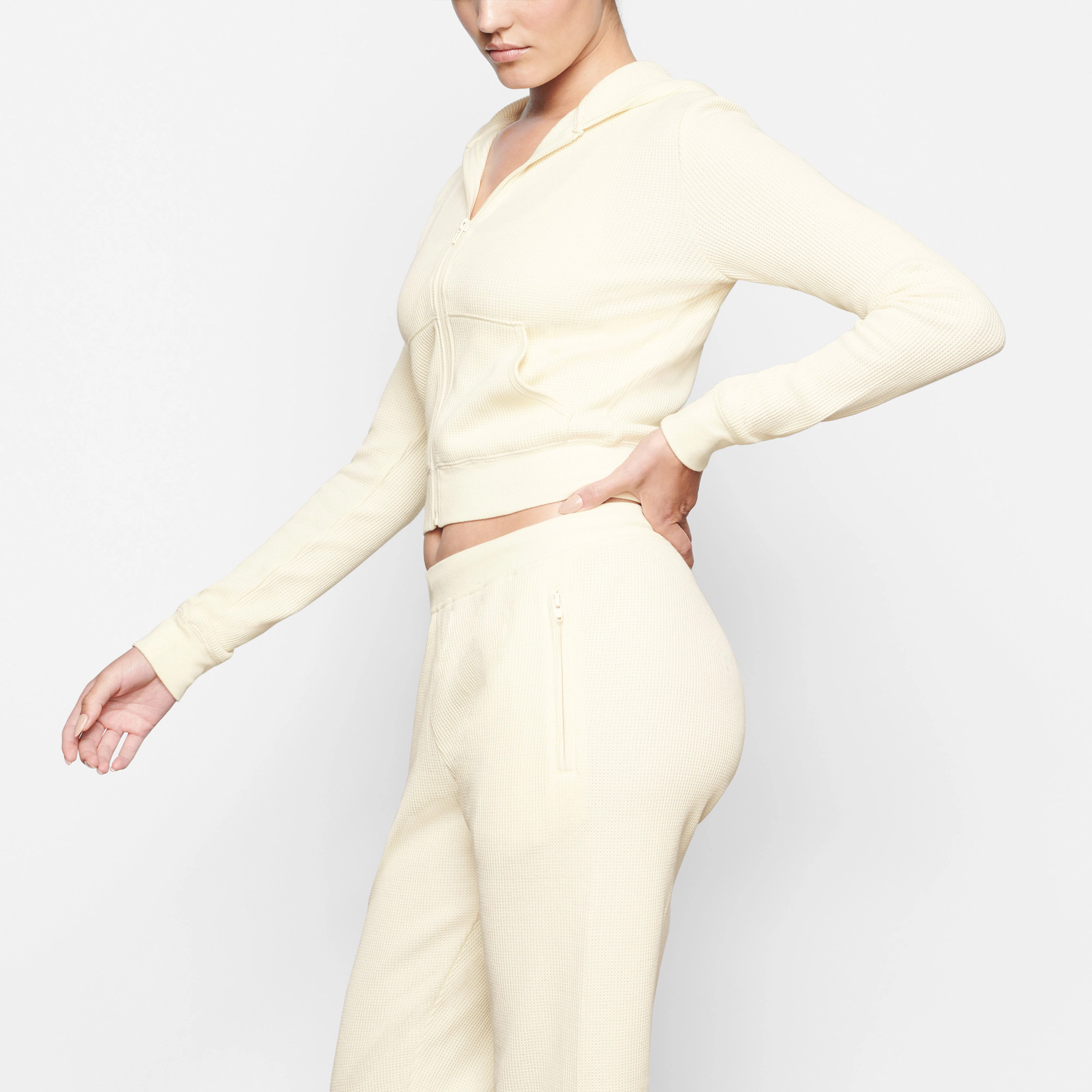 A MODEL WEARS THE WAFFLE HOODIE