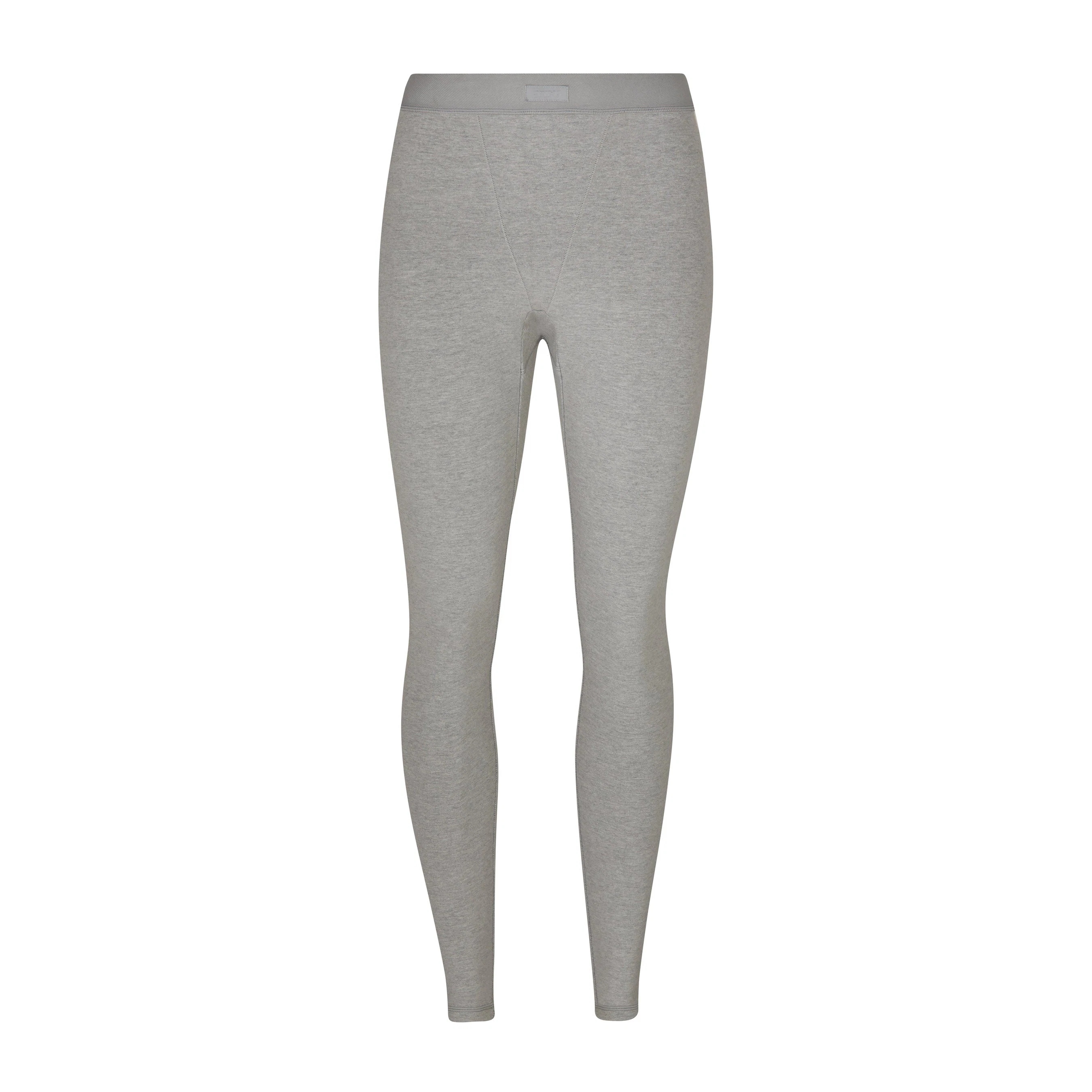 OUTDOOR BASICS SEAMED LEGGING LAYS FLAT ON A WHITE BACKGROUND