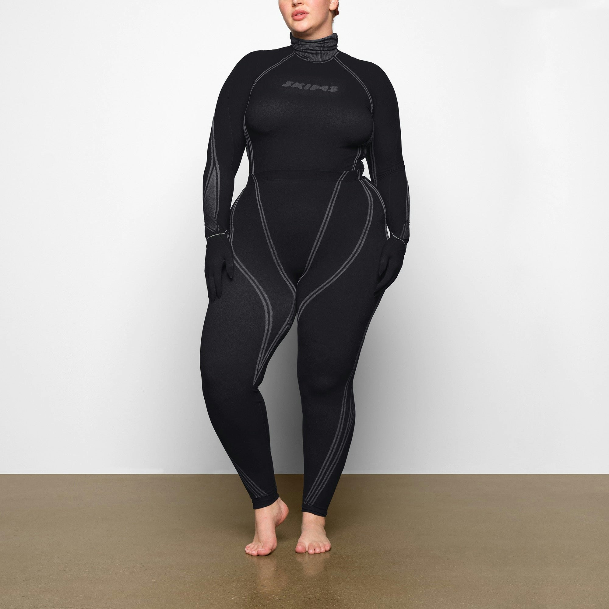 WARP KNIT LEGGING WORN BY A MODEL IN BACK VIEW