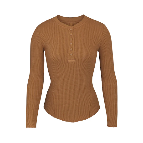 WAFFLE LONG SLEEVE HENLEY LAYS FLAT ON A WHITE BACKGROUND