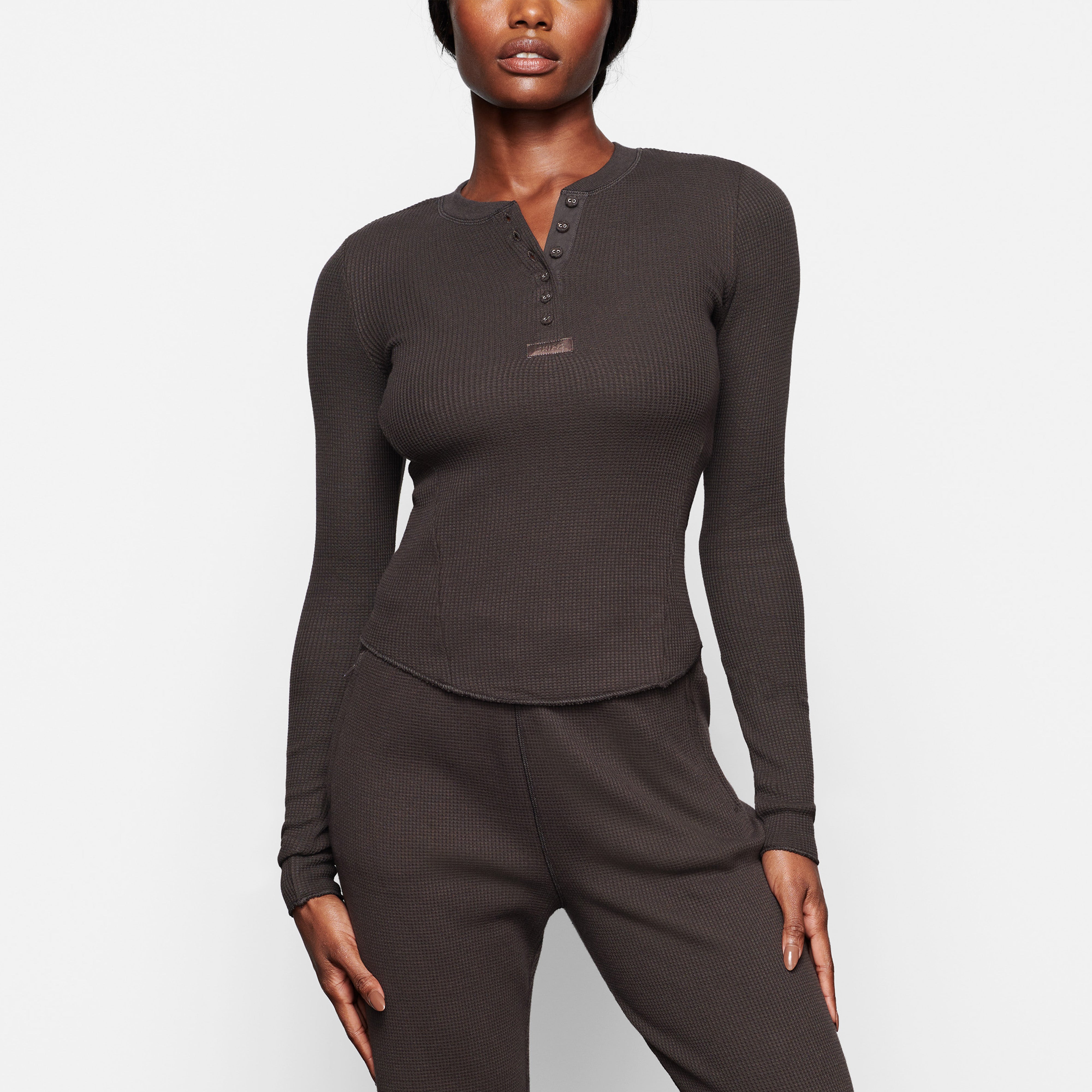 WAFFLE LONG SLEEVE HENLEY ON A MODEL