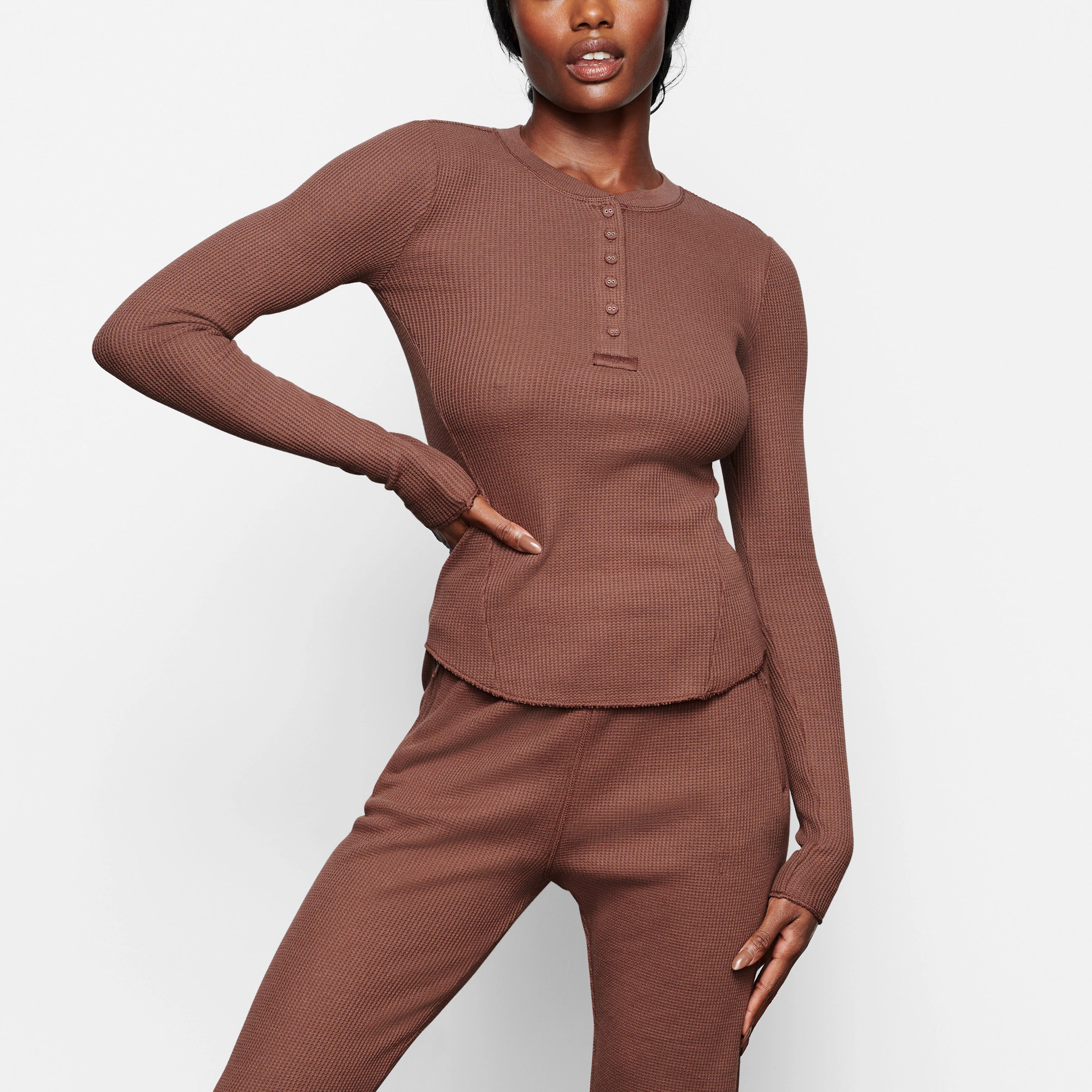 WAFFLE LONG SLEEVE HENLEY ON A MODEL