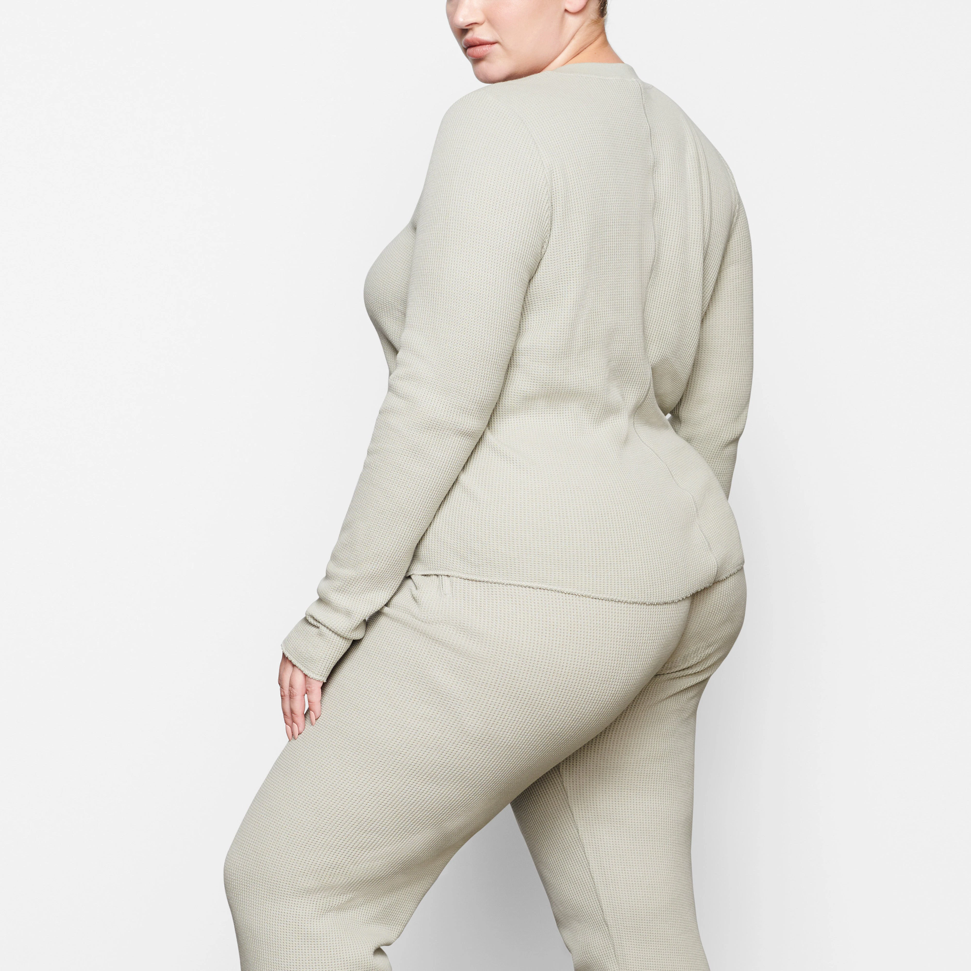 WAFFLE LONG SLEEVE HENLEY ON A MODEL