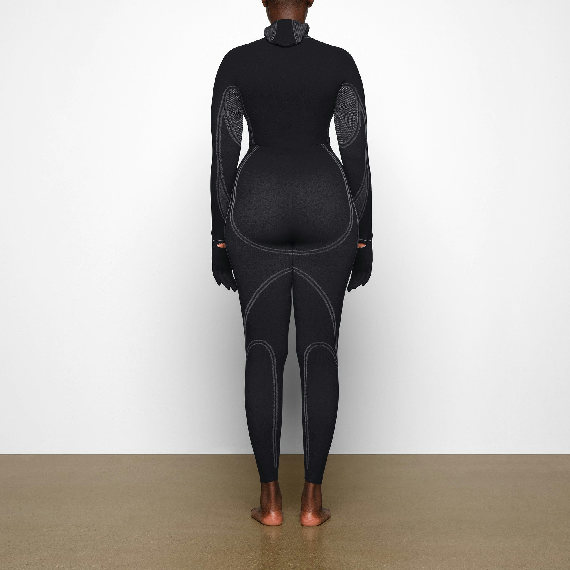 WARP KNIT TOP WORN BY A MODEL IN BACK VIEW