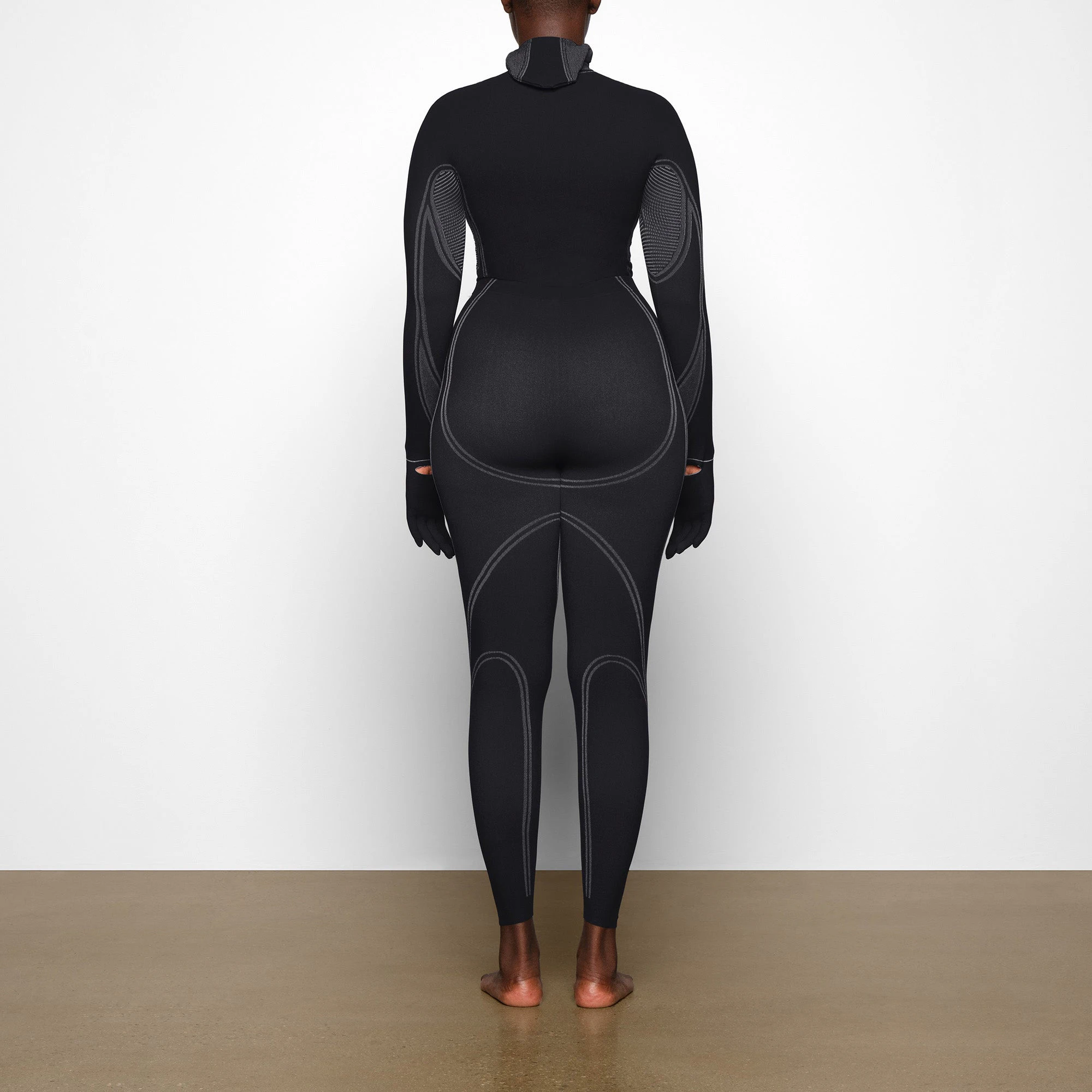 WARP KNIT TOP WORN BY A MODEL IN BACK VIEW