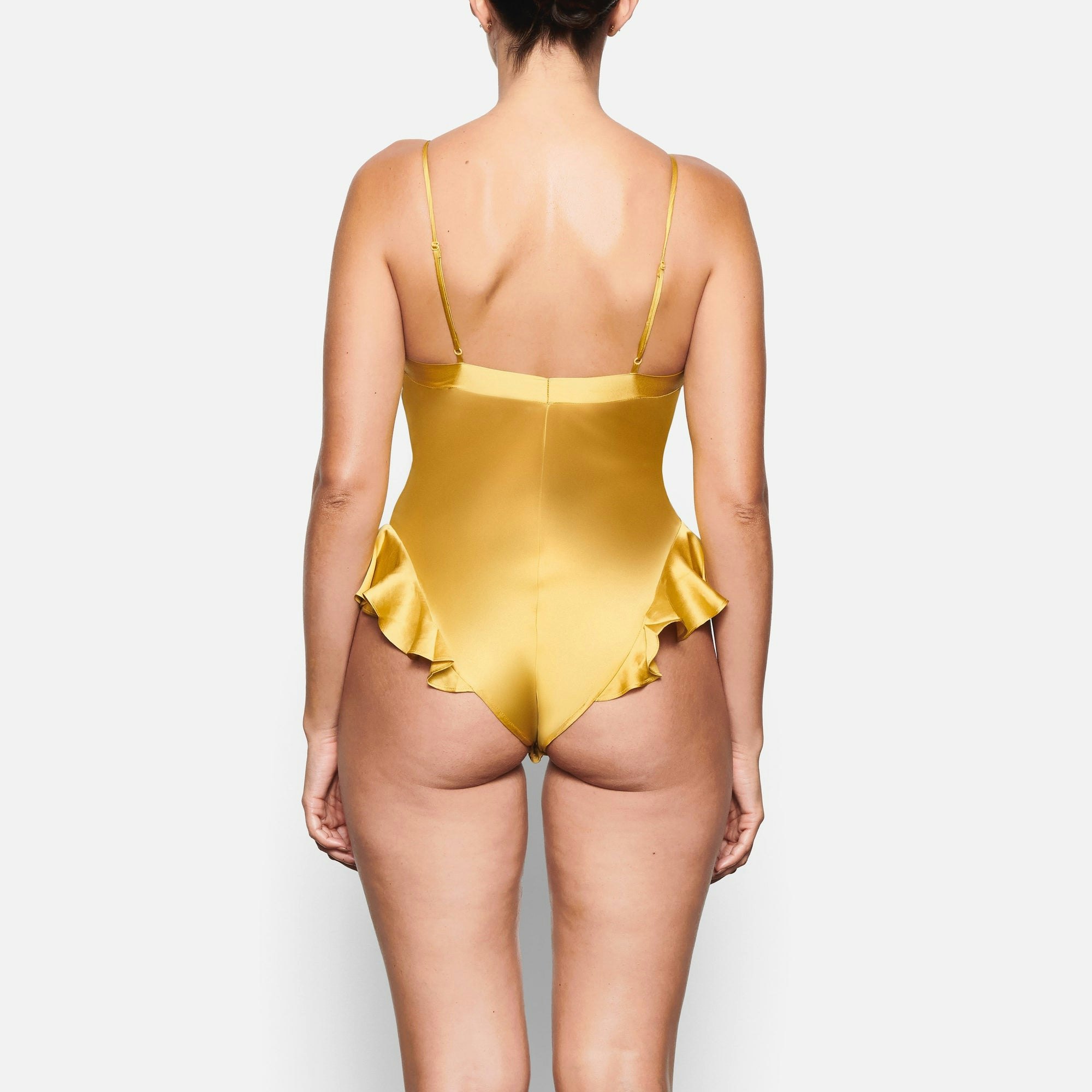 BACK VIEW OF THE SILK TEDDY ON A MODEL