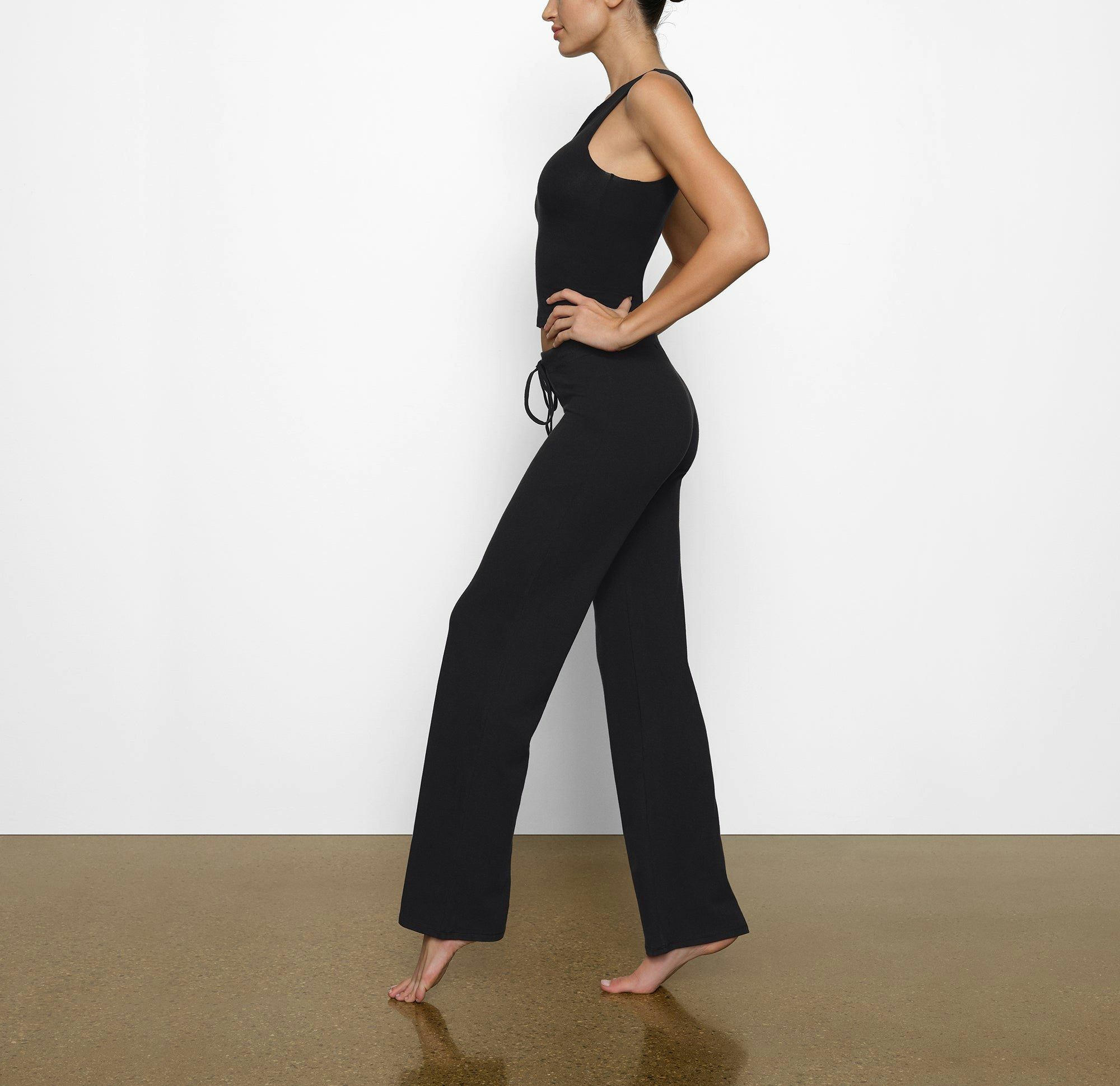 COTTON JERSEY STRAIGHT LEG PANT WORN BY A MODEL IN SIDE VIEW