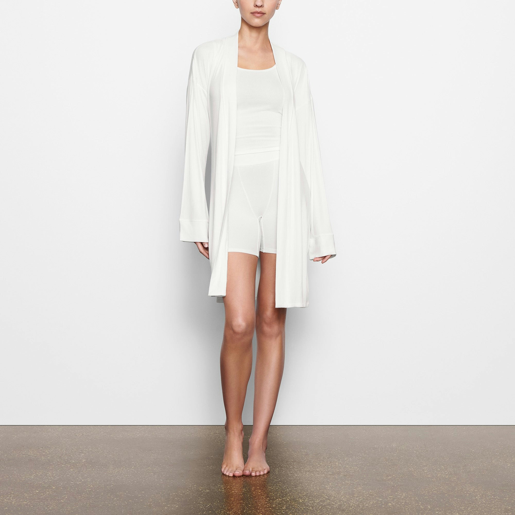 WORN BY A MODEL IN SIDE VIEW SOFT LOUNGE ROBE